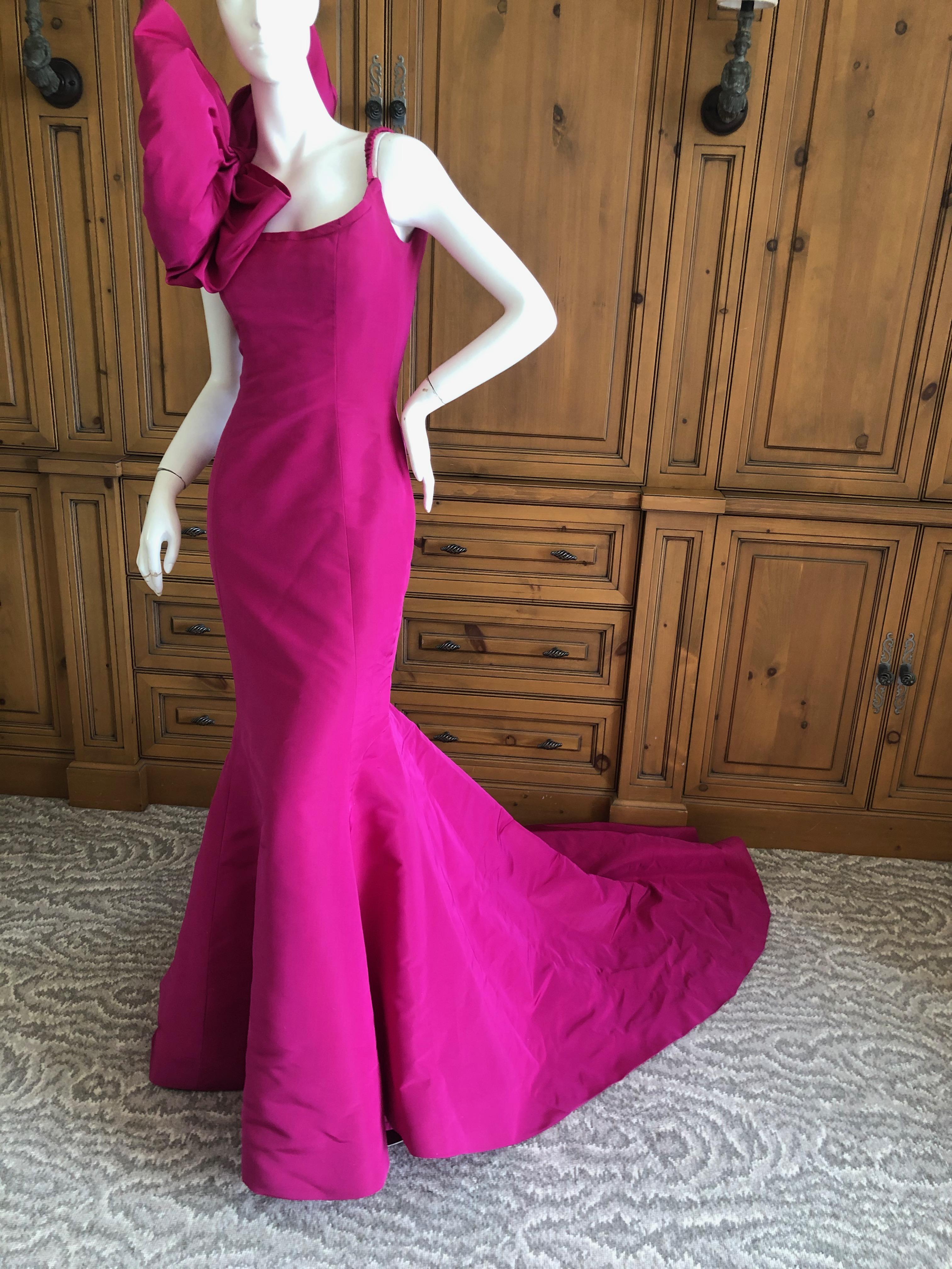 Oscar de la Renta Hot Pink Vintage Mermaid Dress w Inner Corset  and Long Train.
There is a huge bow on one shoulder, simply sublime.
 Stunning. Please use the zoom feature to see all the remarkable details.
Size 2, there is no size tag.  This might