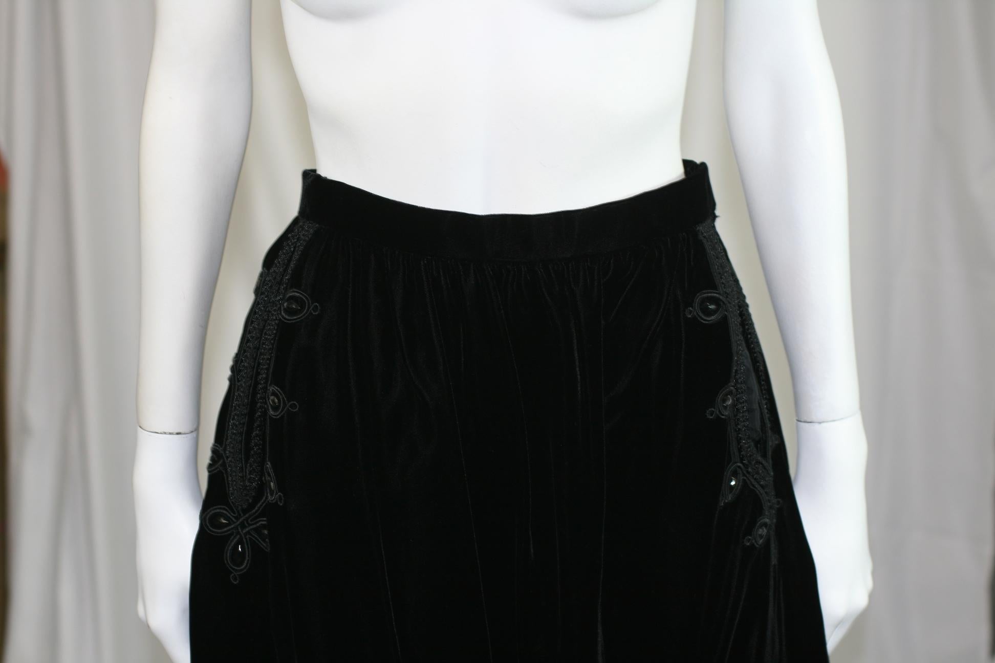 Oscar de la Renta Ink Black Hussar Style Velvet Skirt with passementerie braid trim and jet beading along slash pockets and hem, a timeless classic from Oscar de la Renta which can be worn in so many ways.
size 6 vintage. (vintage sizes run smaller