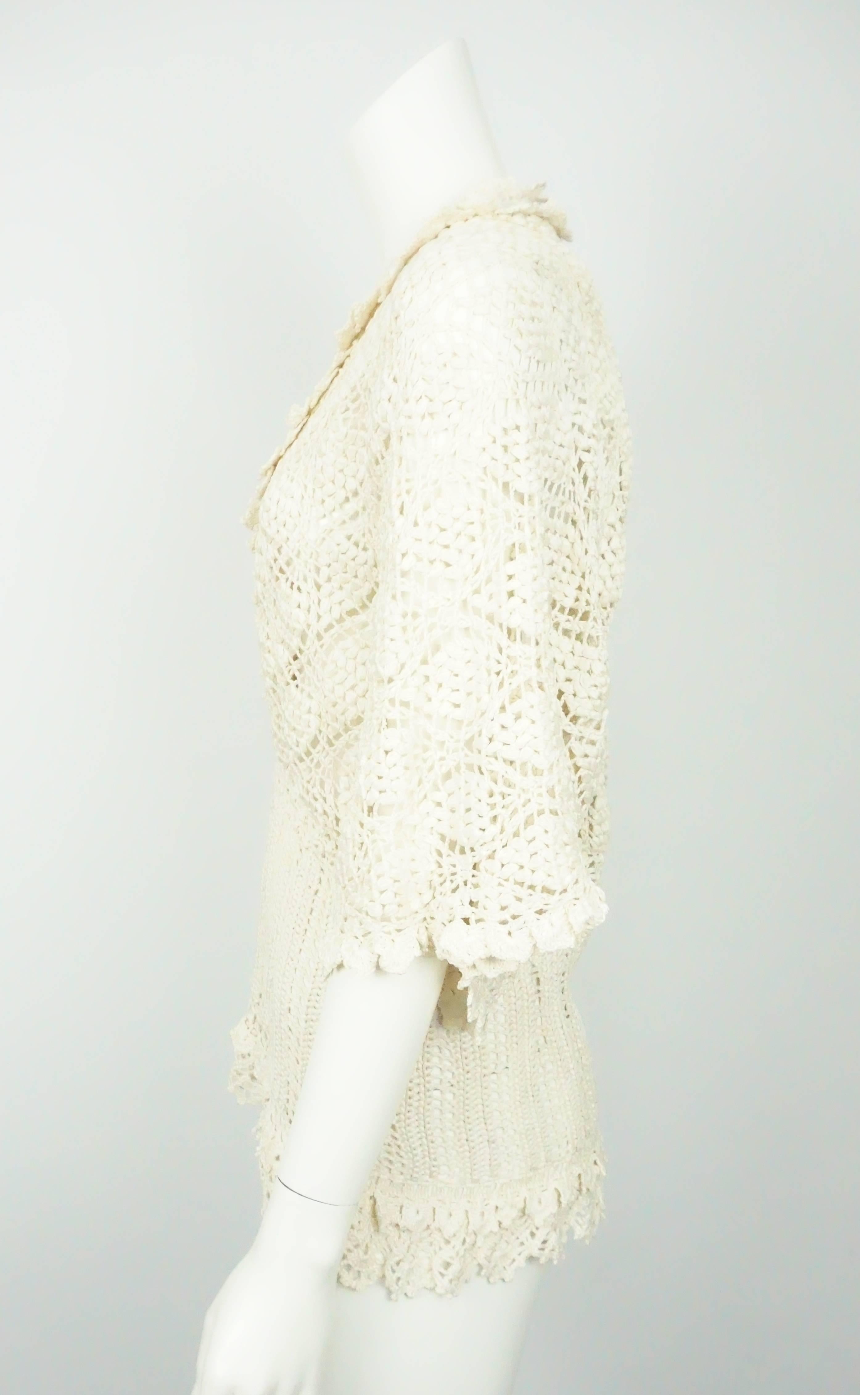 Oscar De La Renta Ivory Silk Crochet Top - L This fully crochet Oscar De La Renta top is completely made from silk. It has a plunging v-neck, floral crochet trimming double layer bottom trimming, ribbon woven in by the neck, over sized sleeves,