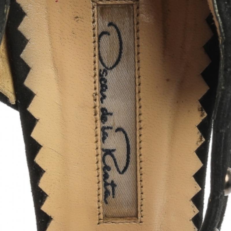 An exclusive pair for you to help you make a statement! These Oscar de la Renta sandals are crafted from black lace and suede and styled in a peep-toe silhouette. They feature stud embellishments on the ankles and zip fastening on the counters.