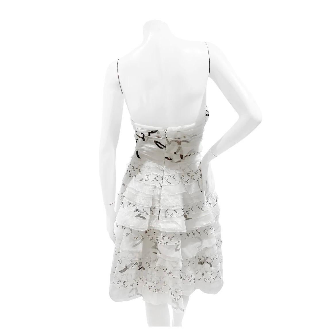 Black and White Logo Tiered Dress by Oscar de la Renta
Spring / Summer 2018
Made in USA
Black and White 
ODLR logo print detail
Corset top
Strapless
Layered tier style 
Built in padded breast cups
Back invisible zipper closure with clasp
Fabric