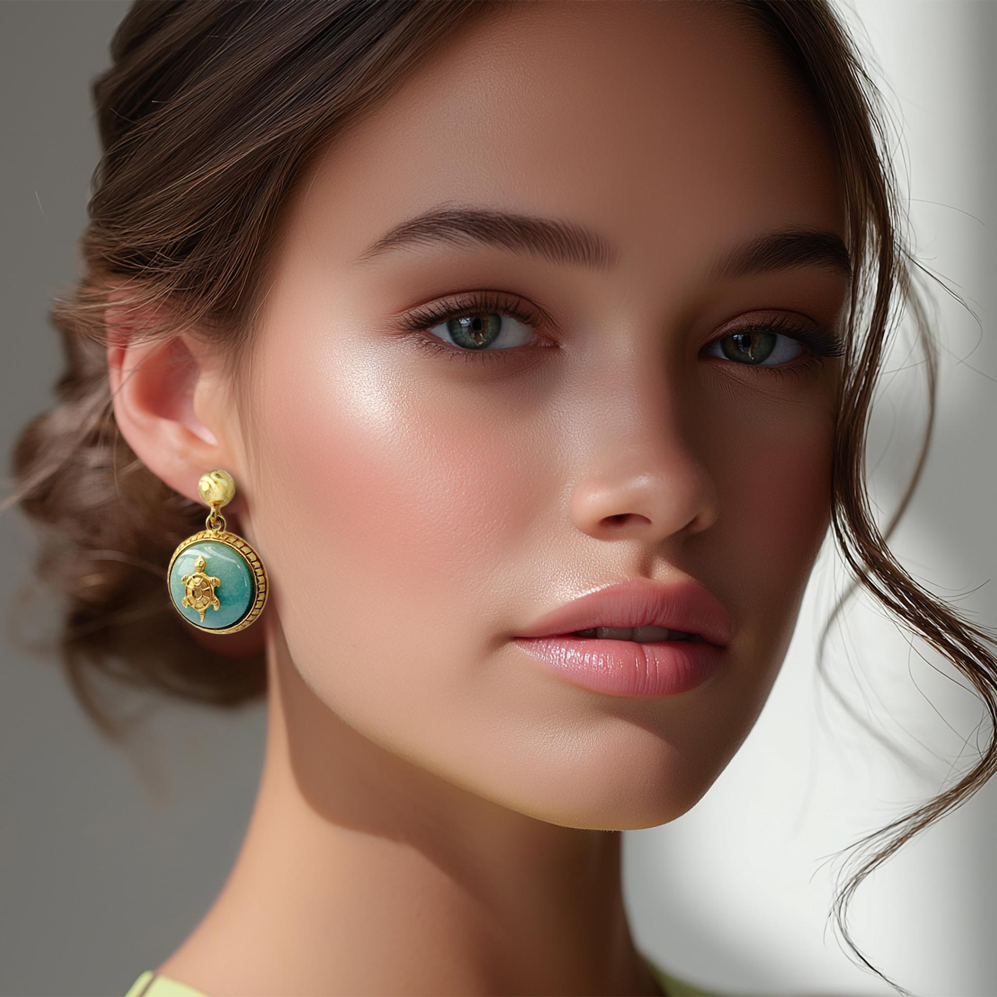 Oscar de la Renta gold jade tortoise drop earrings featuring hand-carved turtle motifs in antique gold frames. Authentic designer fashion jewelry, made in USA.

Oscar de la Renta luxury designer jewelry demonstrates the house's mastery of