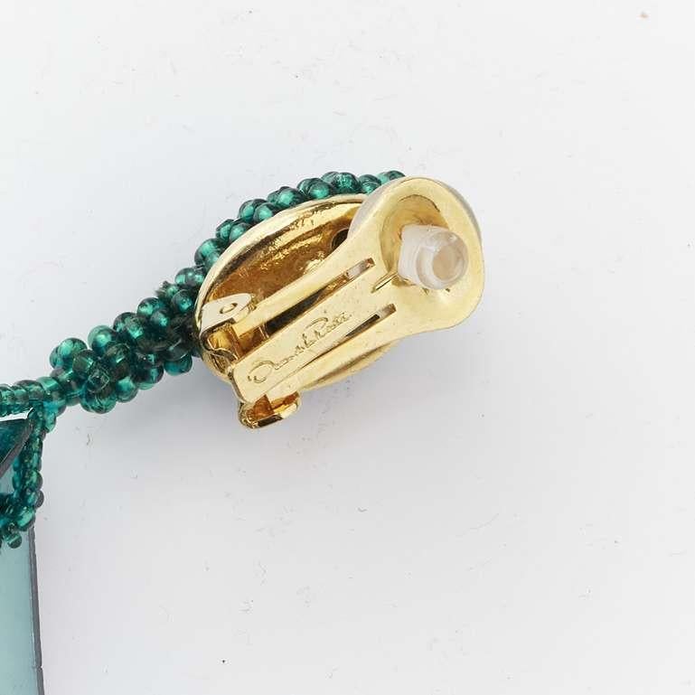 OSCAR DE LA RENTA metallic green beaded petals tassels drop clip on earrings For Sale 4