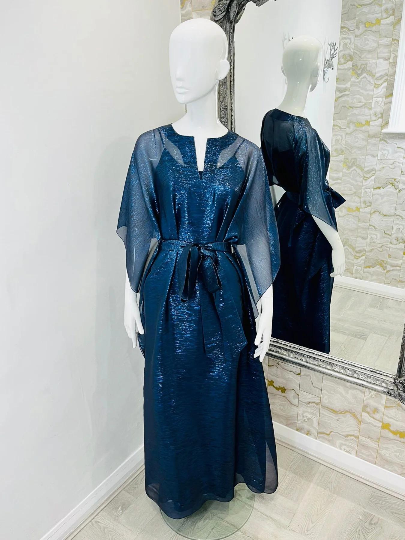 Oscar De La Renta Metallic Silk Evening Dress

Navy blue, with almost silver threads, maxi evening gown, with ruffle sides and self tie, belted waist. Sheer dress with matching slip. 

Additional information:
Size – M
Composition – 70% Silk, 30%