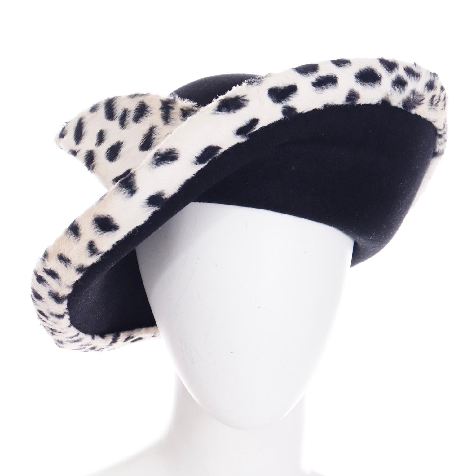 We always love finding vintage Oscar de la Renta hats! His hats are always well made and we especially appreciate the unique style, details and fabrics that make them stand out. This vintage black and white wool faux fur hat has dramatic snow