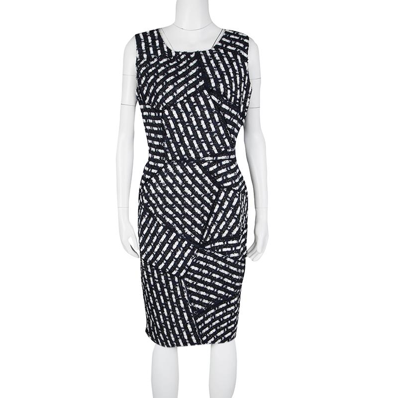 Give your evenings out a quirky twist with the Oscar De La Renta Multicolor Textured Patch Detail Sleeveless Dress. This dress features a square neck and a very unique textured pattern all over the body in a patch detail. This mid length dress is