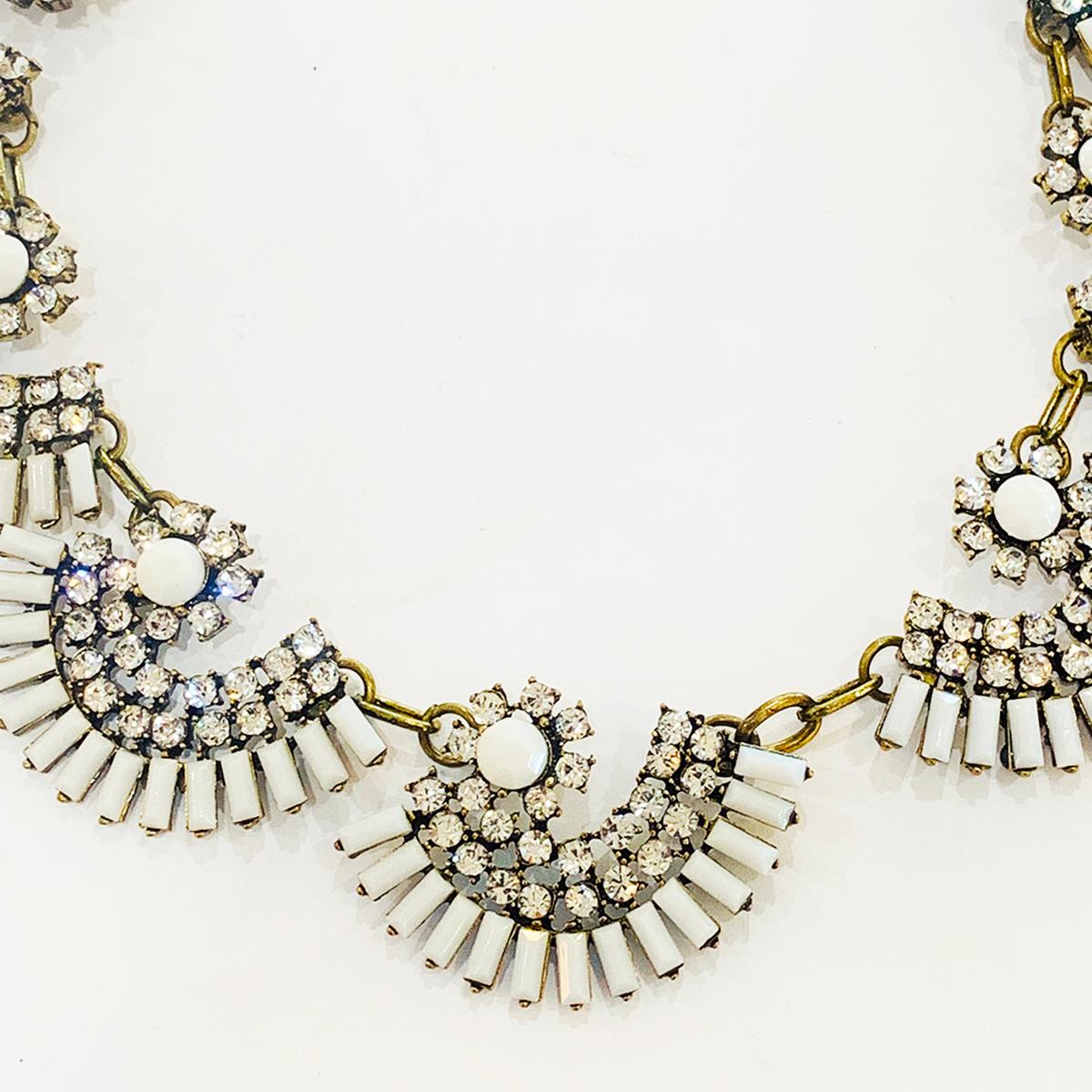 An Oscar De La Renta Necklace in Milk Glass and white Diamantes on an aged gilt ground. Totally perfect with no damage, no repairs , no losses. The necklace is adjustable so the length can be change to suit either the neck size or the front dress