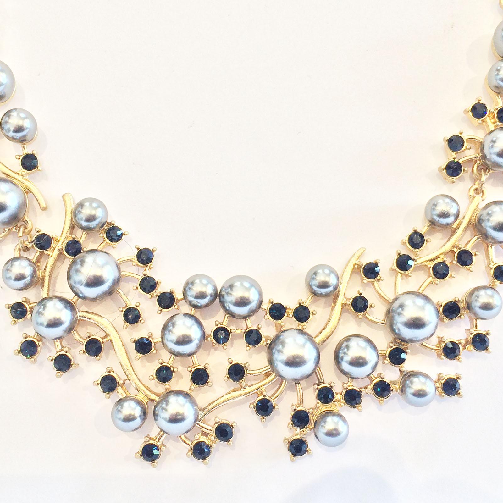 Oscar De La Renta Necklace with Grey Pearls on Gilt, with Onyx Diamantes. A wonderful design with the contrast of the grey and black, on the gold tone backing, with the single faux pearls along each side approaching the rear clasp of a gilt Lobster