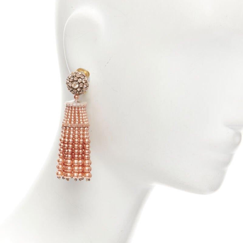 OSCAR DE LA RENTA orange crystal faux pearl tassel drop clip on earrings
Reference: TGAS/C01477
Brand: Oscar de la Renta
Material: Plastic
Color: Orange
Pattern: Solid
Closure: Clip On
Estimated Retail Price: USD 600
Made in: