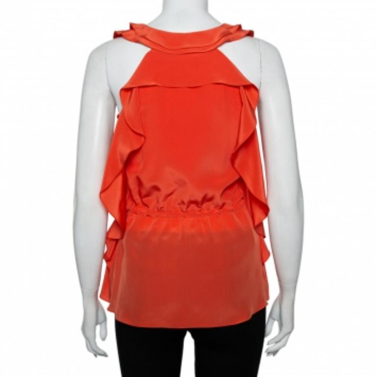 This top from Oscar de la Renta is stunning. It is crafted from quality materials and has ruffle detailing throughout that adds interest. The sleeveless top is cut to offer a good fit, features a round neck and a zip fastening. The top is great for