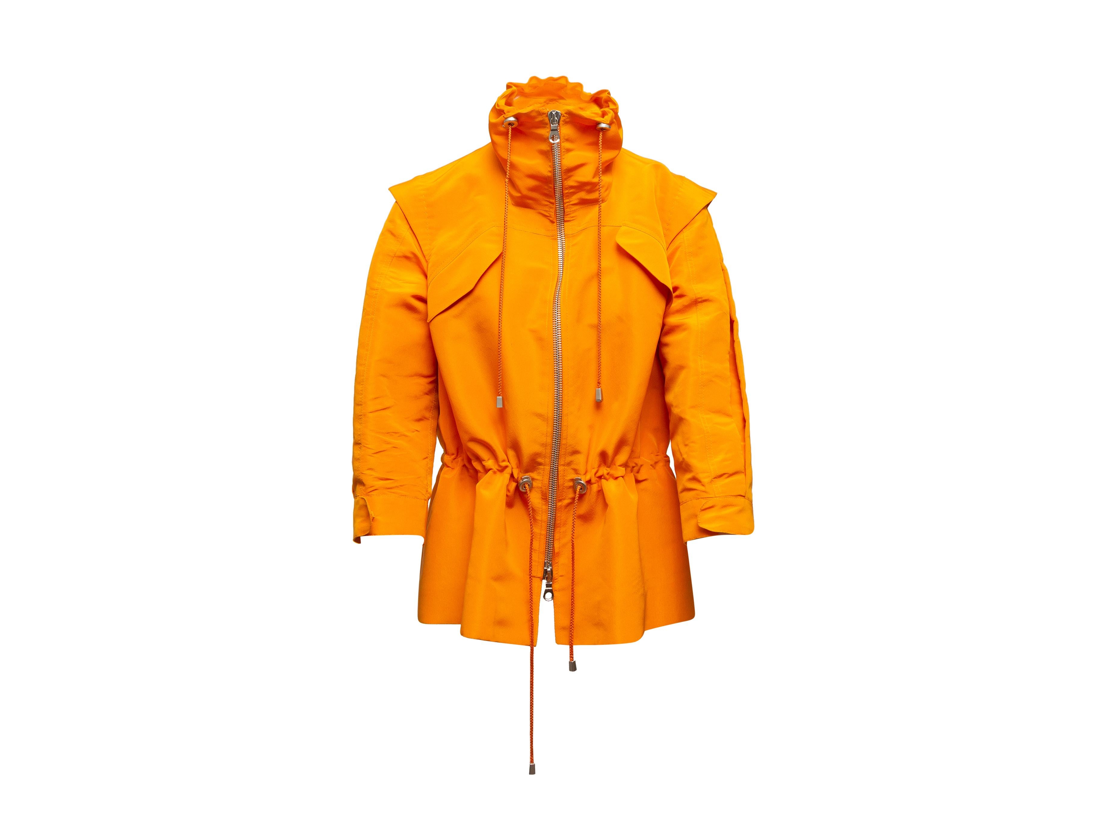 Product details: Orange silk jacket by Oscar de la Renta. High collar featuring drawstring. Drawstring at waist. Zip closure at center front. 40
