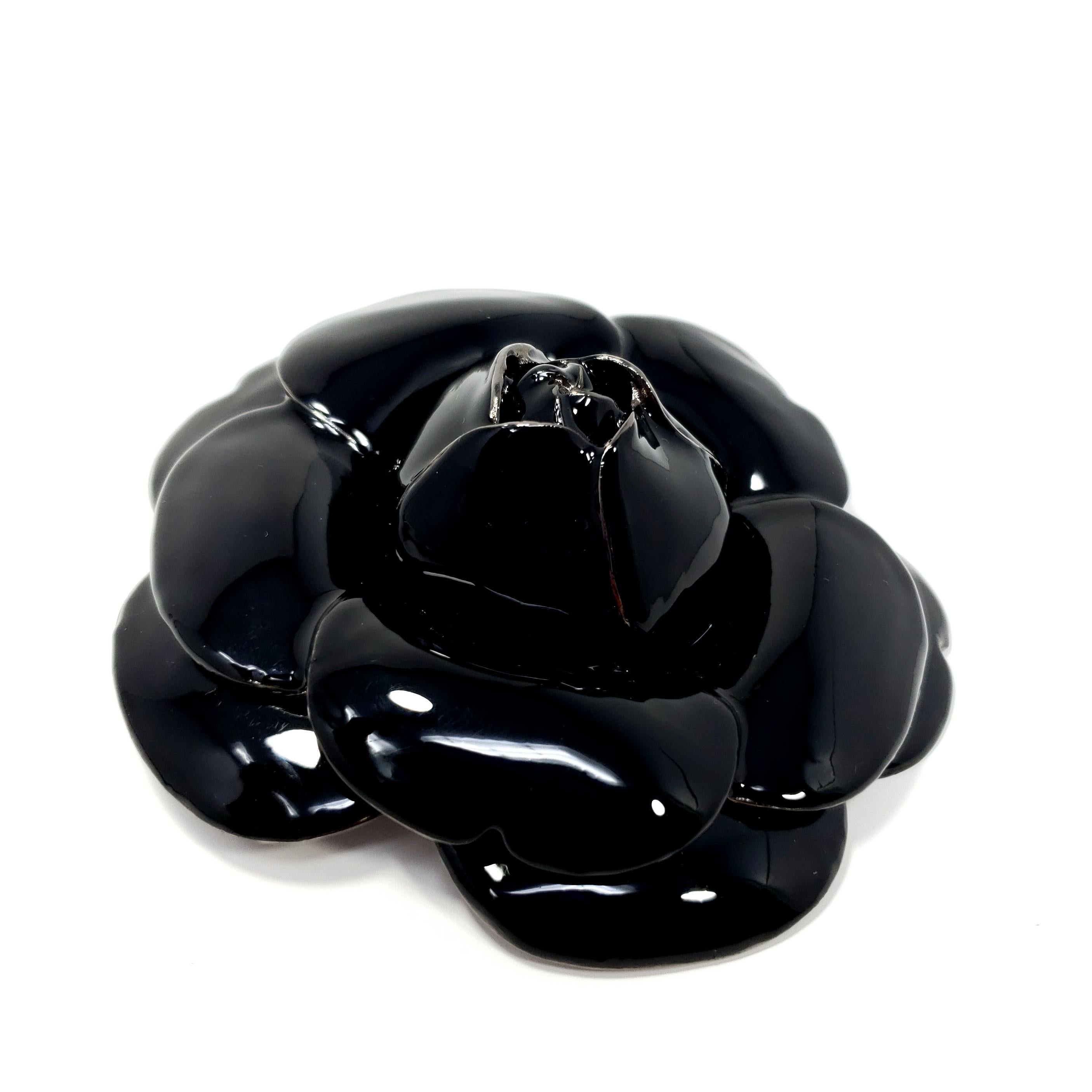 Best in black! You've always been a stunner, now get a brooch to match it! Large impressive Oscar de la Renta brooch pin in reflective black enamel.

Please keep in mind this brooch is heavy and is not fit to hang from thin or delicate clothing.