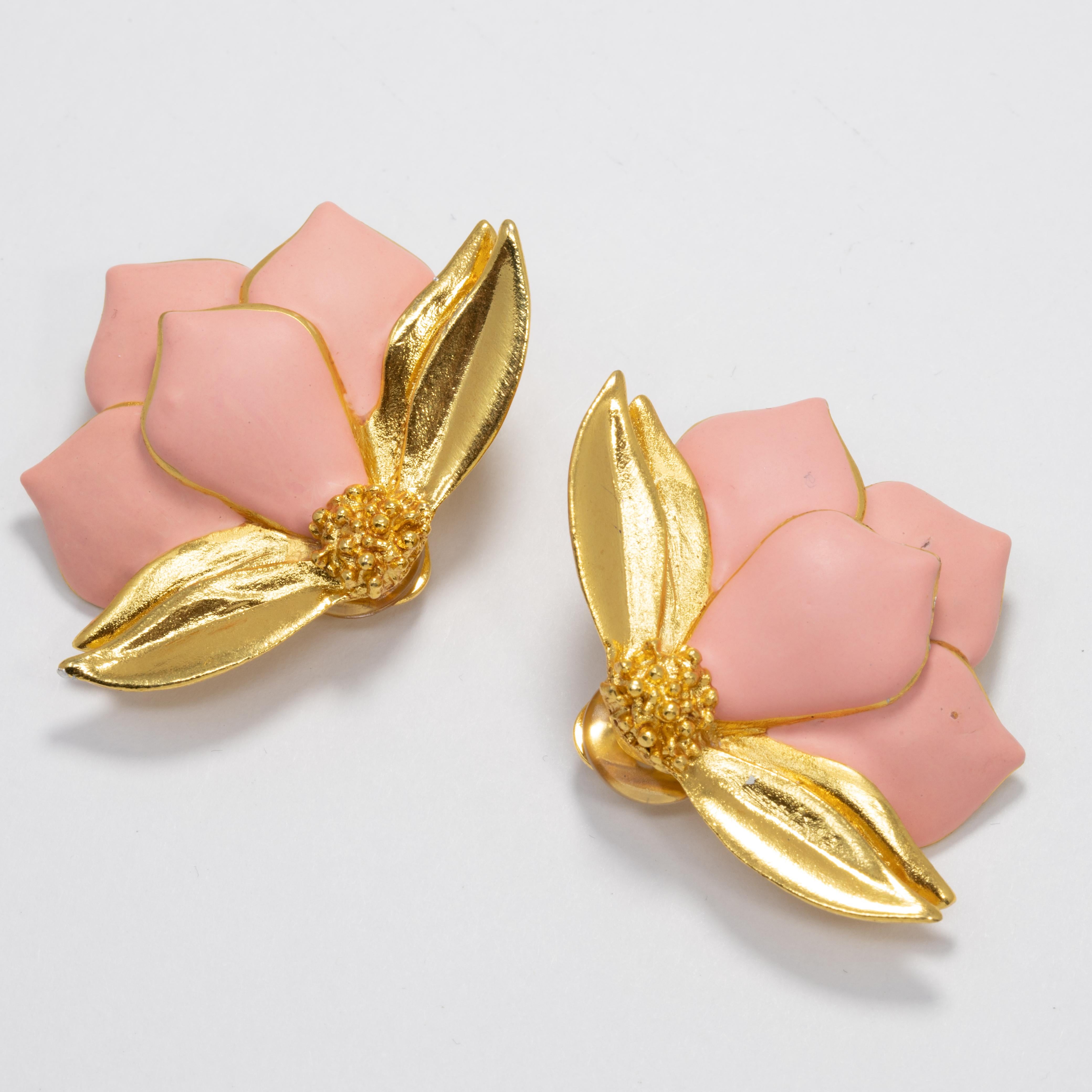 Pair of Oscar de la Renta clip on earrings, featuring gold flowers with painted pink petals.

Hallmarks: Oscar de la Renta, Made in USA