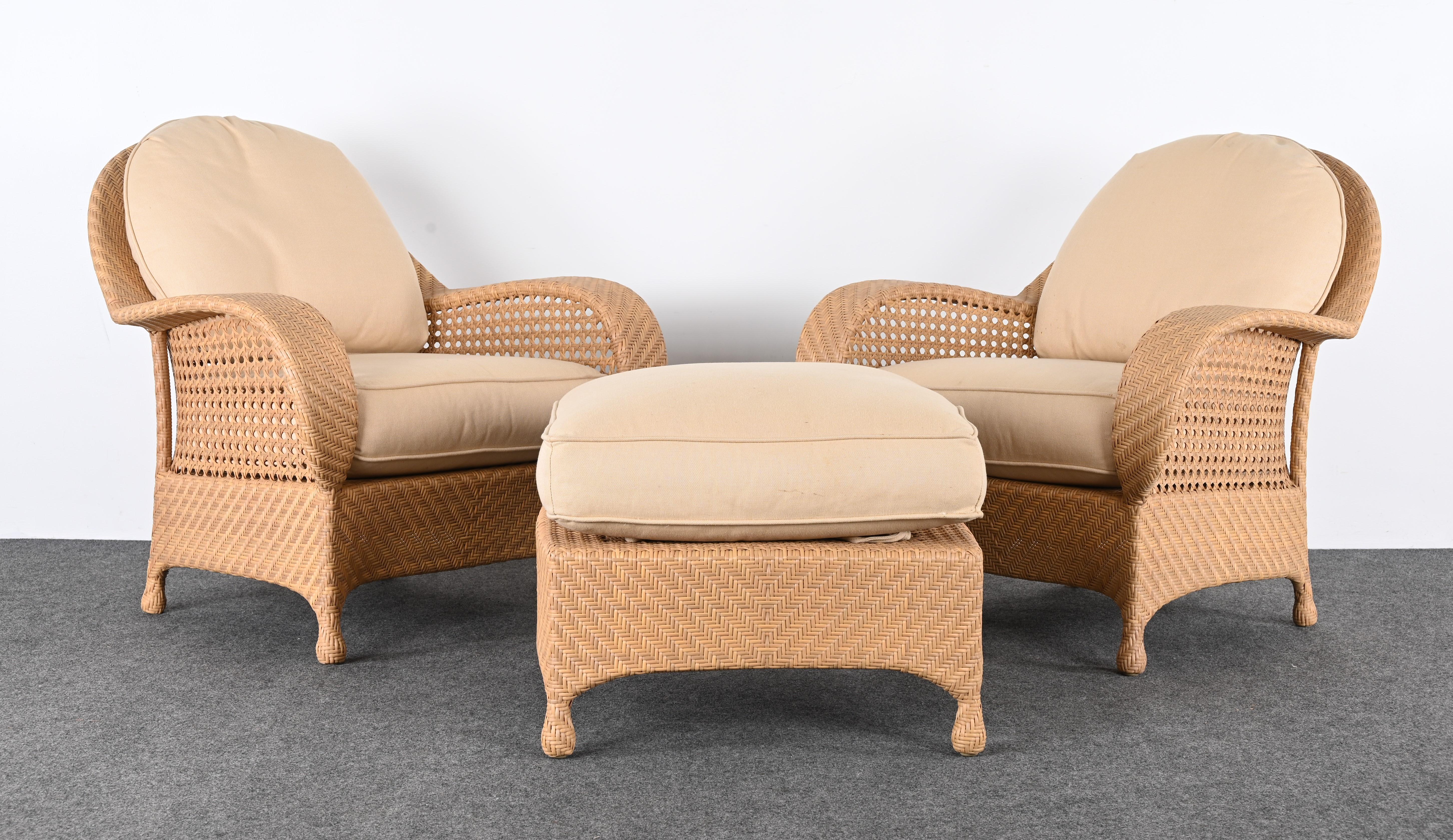 A fabulous set of resin wicker lounge chairs and ottoman by designer Oscar De La Renta. These pieces are made of a 21st-century material called Hularo which is resistant to ultraviolet light, rain, salt water, chlorine, sun creams, tanning oils, and