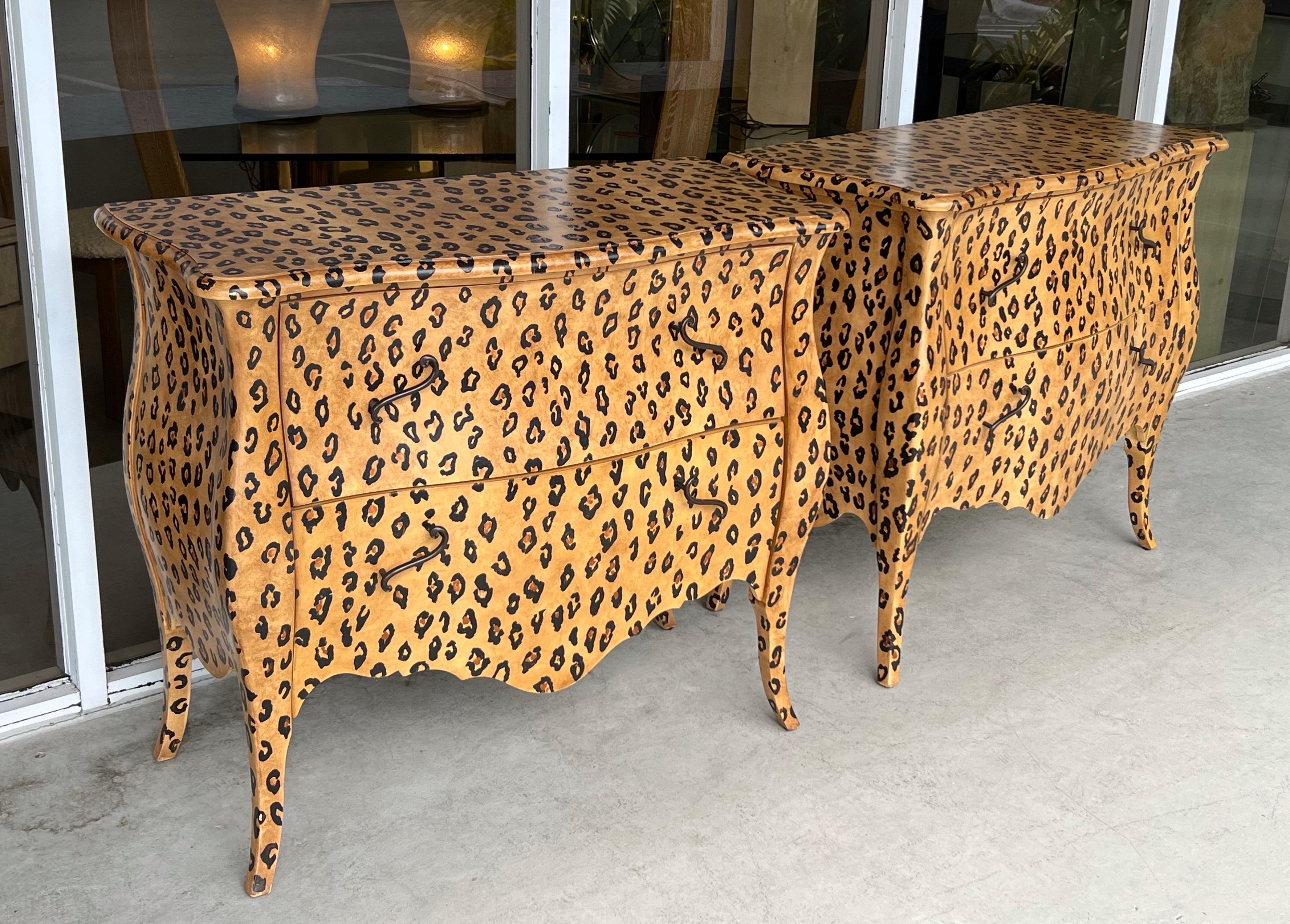 A pair of chests by Oscar de la Renta for Century. Each with 2 large drawers and bronze handles. Hand painted leopard spots cover the graceful cabinets.