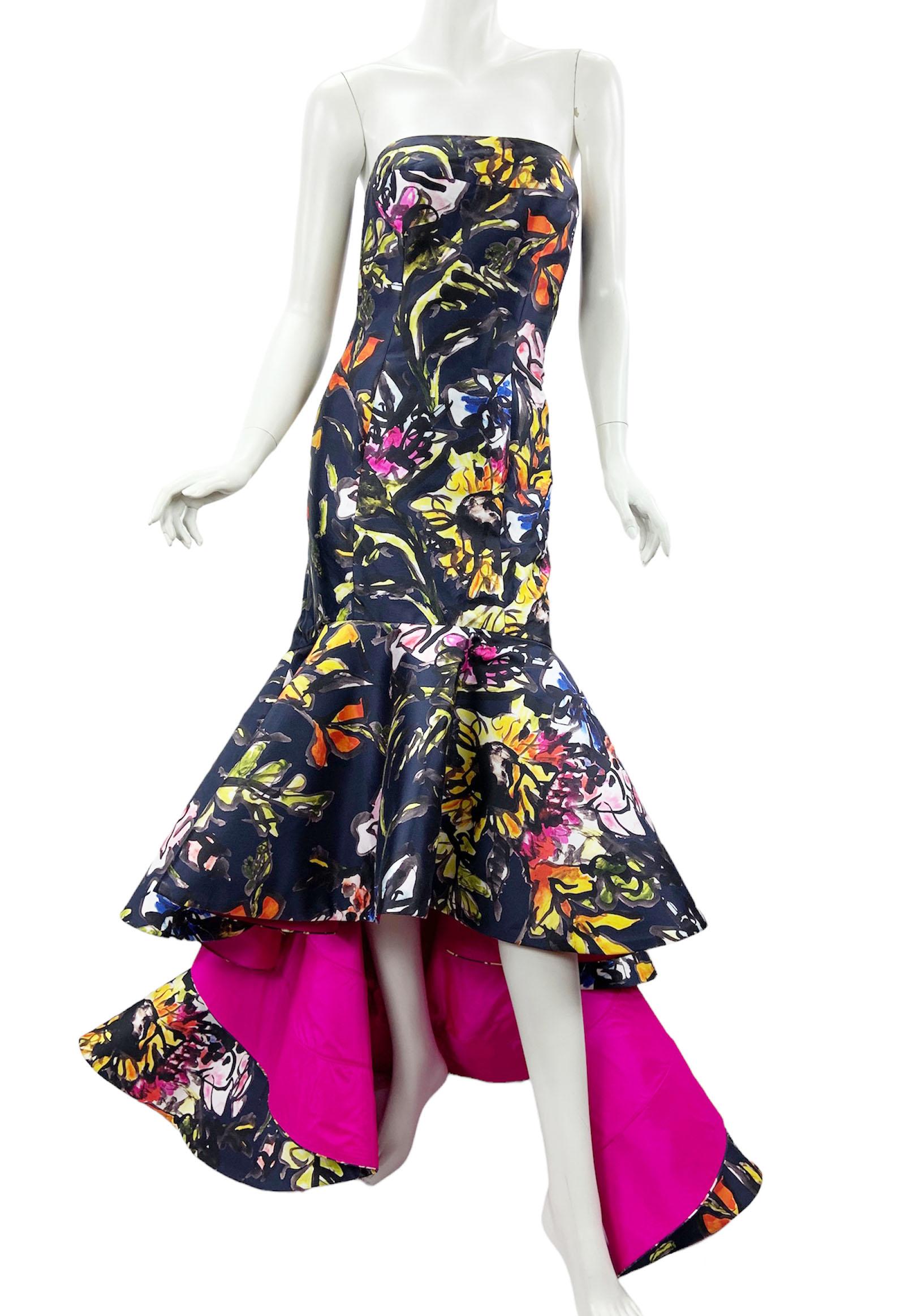 Oscar de la Renta Silk Floral Printed High-Low Dress Gown
P/F 2015 Collection
USA size - 6
Oscar de la Renta printed sateen mermaid gown with contrast reverse. Strapless neckline. Nips in at natural waist. Fitted skirt flares into flowing ruffles at