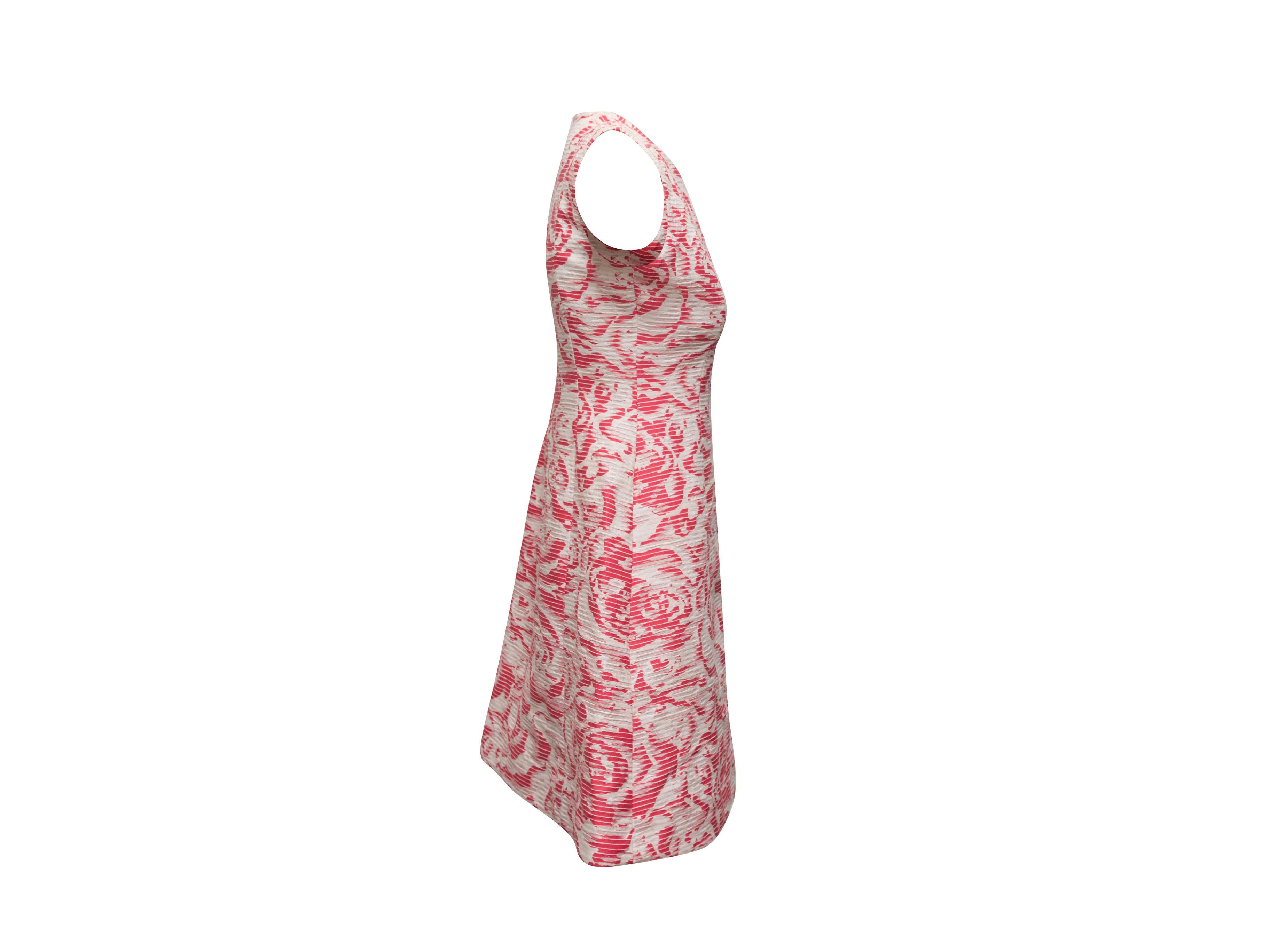 Product details: Pink and white jacquard sleeveless dress by Oscar de la Renta. Sample item from the Resort 2017 Collection. Rose pattern throughout. Crew neck. Zip closure at back. 34