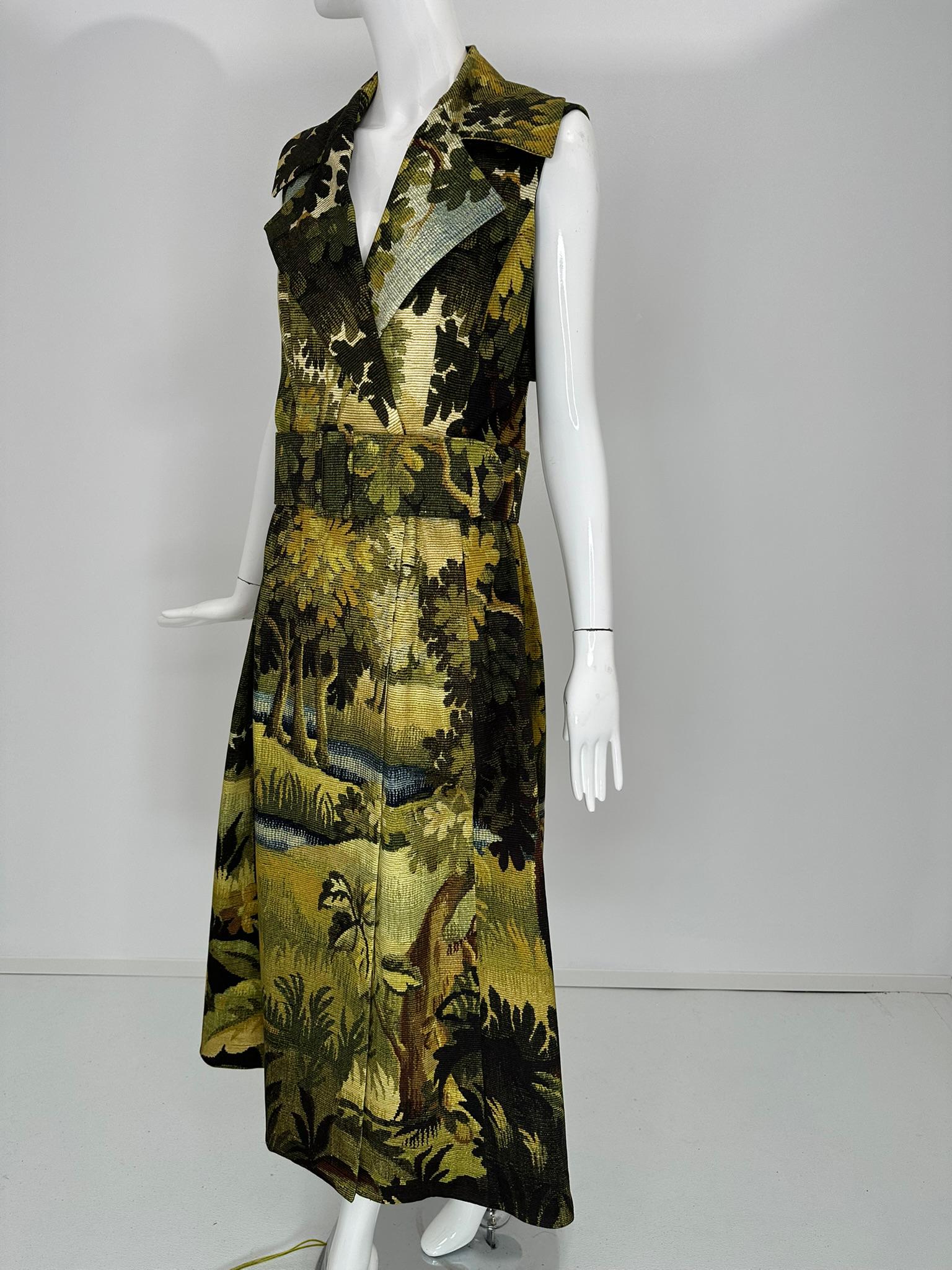Oscar de la Renta, pre fall 2020, landscape tapestry belted wrap front midi dress. Unworn with tags, size 8.
Sleeveless dress with deep lapels, the double breasted dress wraps and closes at the front with hidden snaps. The back of the dress has a