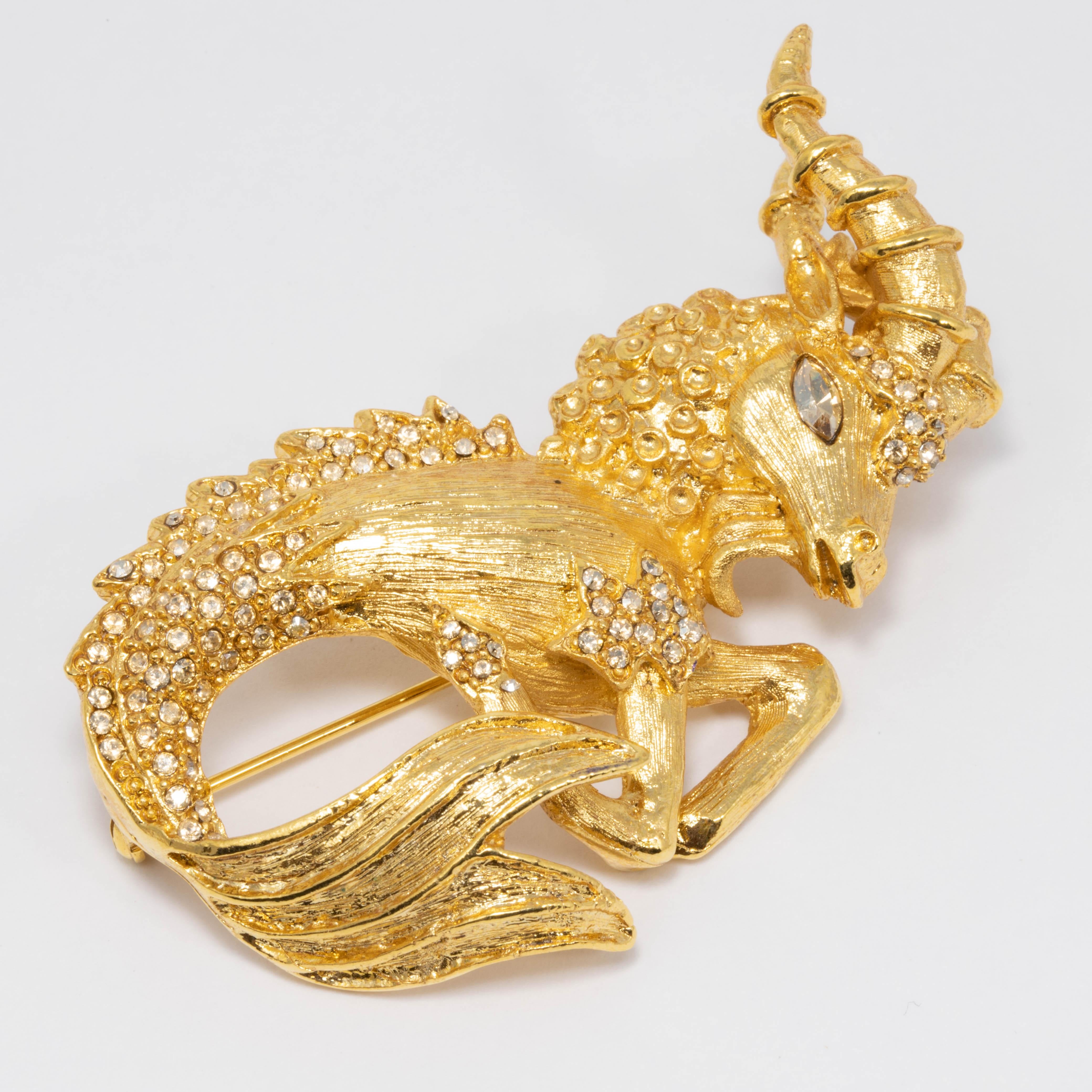 Oscar de la Renta brooch featuring a mystical ram creature based on designs from Elizabethan tapestries. Lend the mythical look to any ensemble with this gold-plated ram brooch set with gold shadow Swarovski crystals.

Tags, Marks, Hallmarks: Oscar