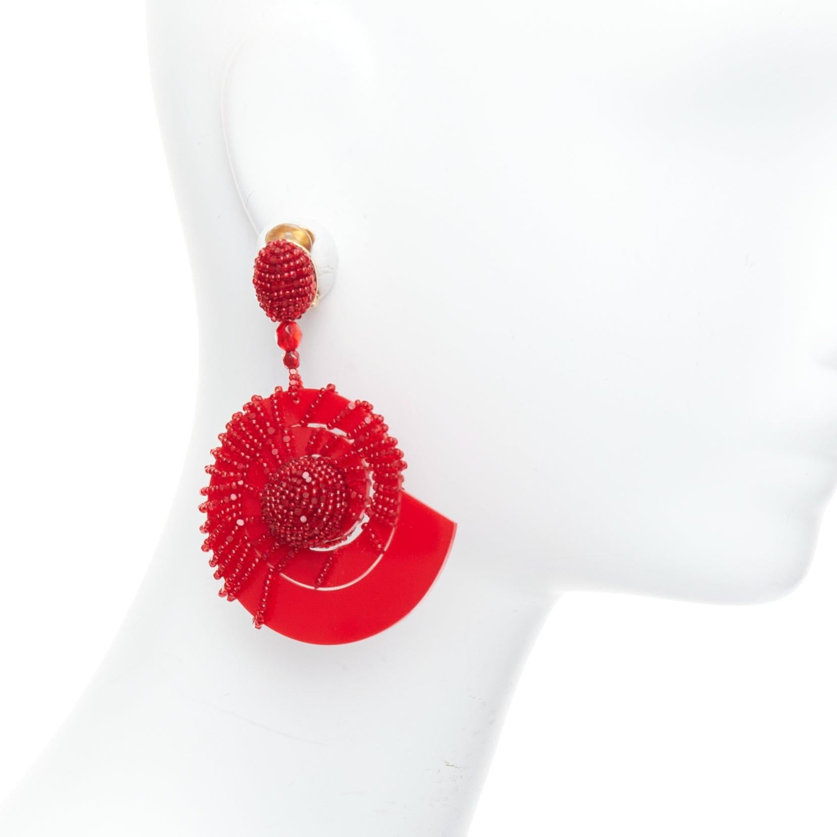 OSCAR DE LA RENTA red beaded acrylic spiral shell dangling clip on earrings pair
Reference: AAWC/A01047
Brand: Oscar de la Renta
Material: Acrylic, Metal
Color: Red, Gold
Pattern: Solid
Closure: Clip On
Lining: Gold Metal
Made in: