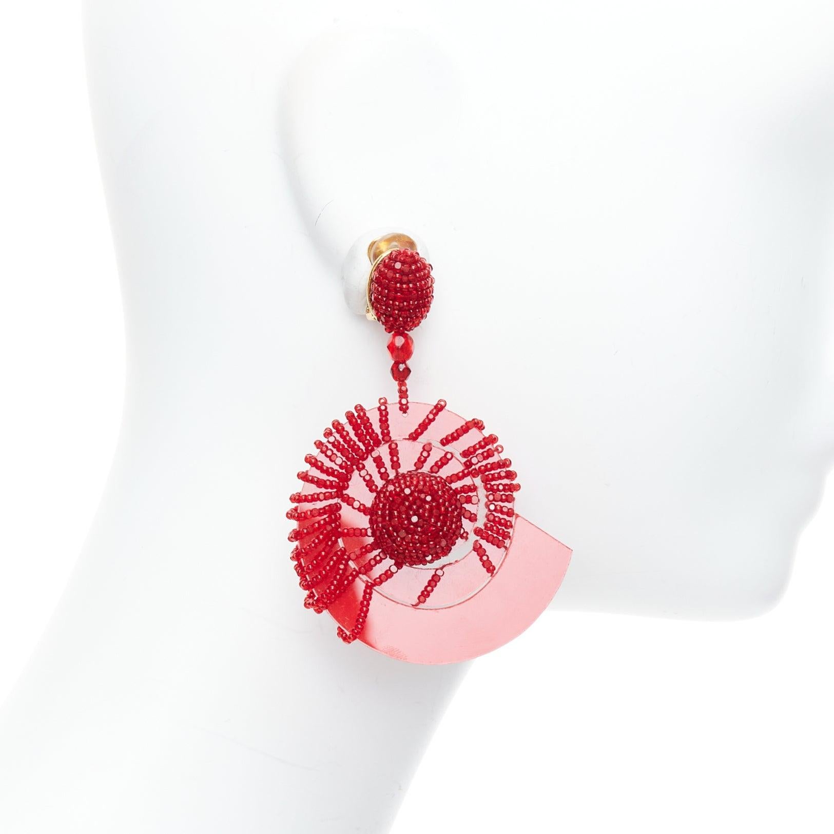 Women's OSCAR DE LA RENTA red beaded acrylic spiral shell dangling clip on earrings pair For Sale