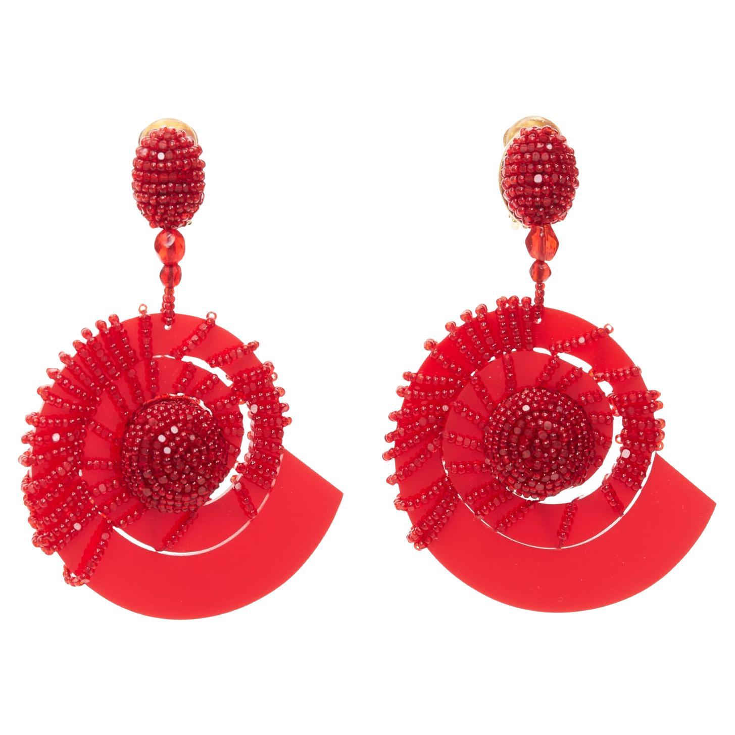 OSCAR DE LA RENTA red beaded acrylic spiral shell dangling clip on earrings pair For Sale