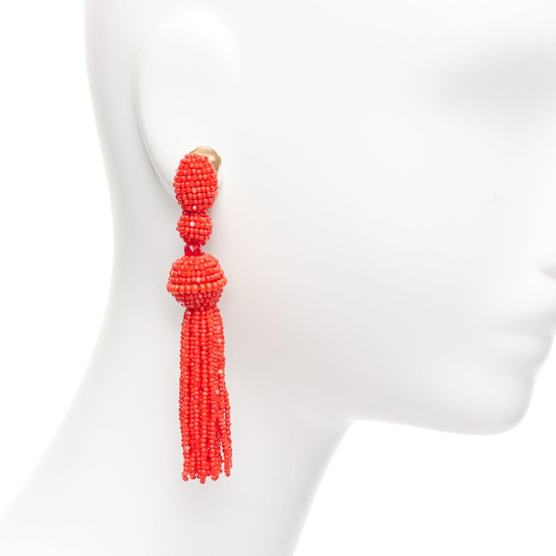 OSCAR DE LA RENTA red beaded tassel dangling chandelier clip on earrings pair
Reference: AAWC/A01051
Brand: Oscar de la Renta
Material: Acrylic
Color: Red, Gold
Pattern: Solid
Closure: Clip On
Lining: Gold Metal
Made in: India

CONDITION:
Condition: