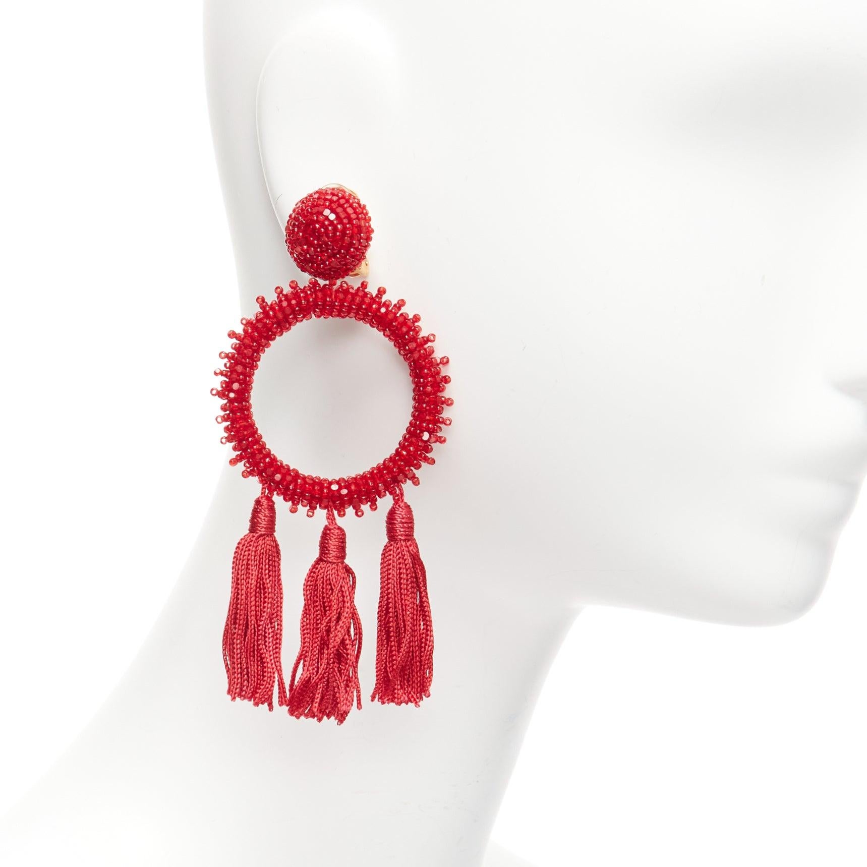 OSCAR DE LA RENTA red beaded tassel fringe circle hoop dangling clip on earrings pair
Reference: AAWC/A01052
Brand: Oscar de la Renta
Material: Fabric, Acrylic
Color: Red, Gold
Pattern: Solid
Closure: Clip On
Lining: Gold Metal
Made in:
