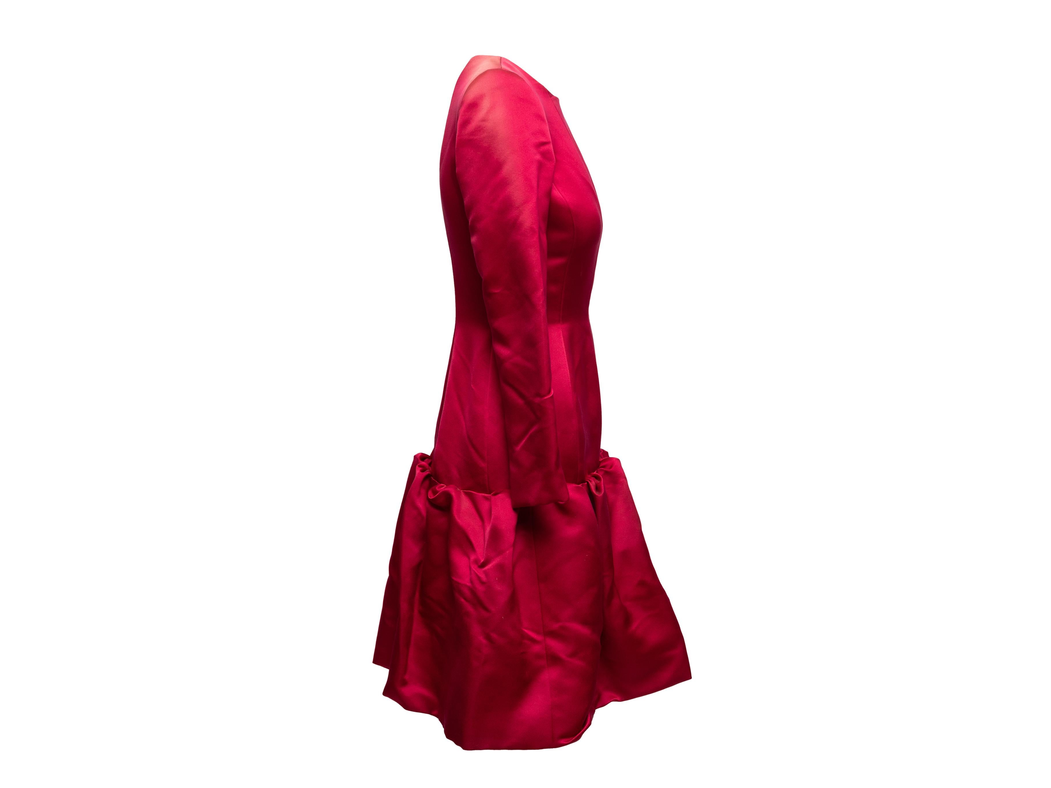 Product Details: Red long sleeve drop waist dress by Oscar de la Renta. Crew neck. Zip closure at back. 34