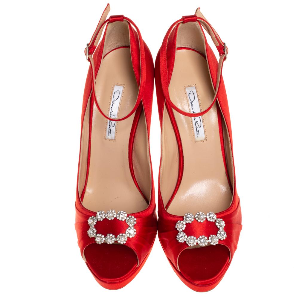 Flaunt your love for fashion when you wear these sandals from Giuseppe Zanotti. Keep it chic and stylish in this pair of red sandals designed from smooth satin. They are styled with peep-toes, crystal embellishments, buckled ankle straps, 14.5 cm