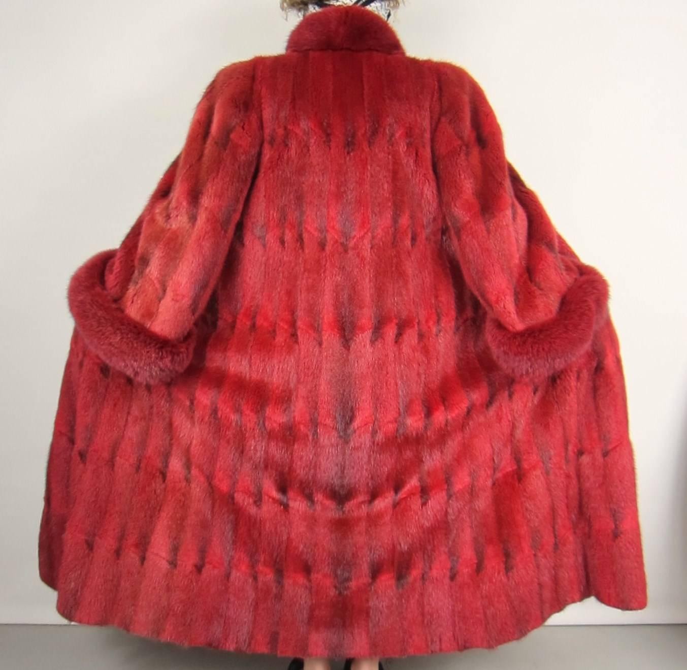 Huge swing on this sheared Oscar De La Renta Full length Fur coat. This has Huge bell Fox Trimmed Sleeves and a Fox trimmed Collar. 5 Clips down the front. 2 Slit front pockets. Measures - Bust 40 - Waist 50 - Sleeve 24 - Cuff 3 - Length 53. Will