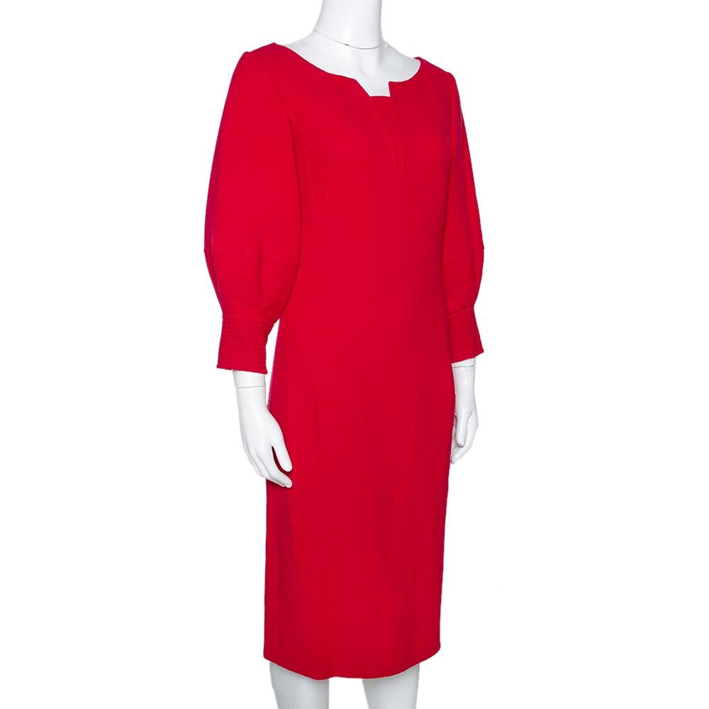 This stunning creation comes from the house of Oscar de la Renta. Crafted from wool with full silk lining, this luxurious dress comes in a red shade and a comfortable midi silhouette. It has been designed with a stylish neckline, balloon sleeves and