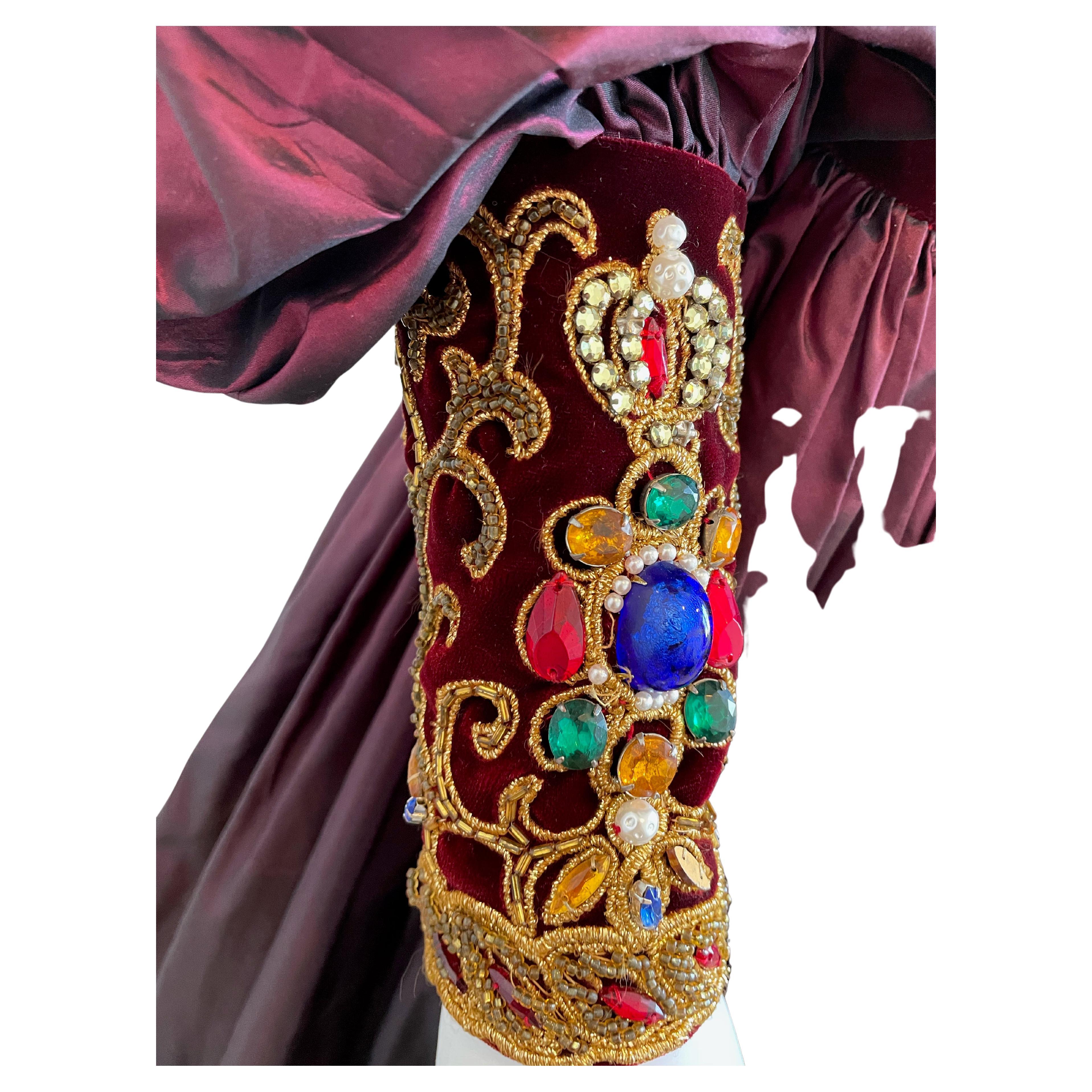 Oscar De La Renta Regal Beaded Ball Gown
Long puff sleeve
Silk & Velvet with bejeweled neckline and jewel adorned cuffs
Size US 6
Please be mindful that this piece has led a previous life, and may tell its story through minor imperfection.