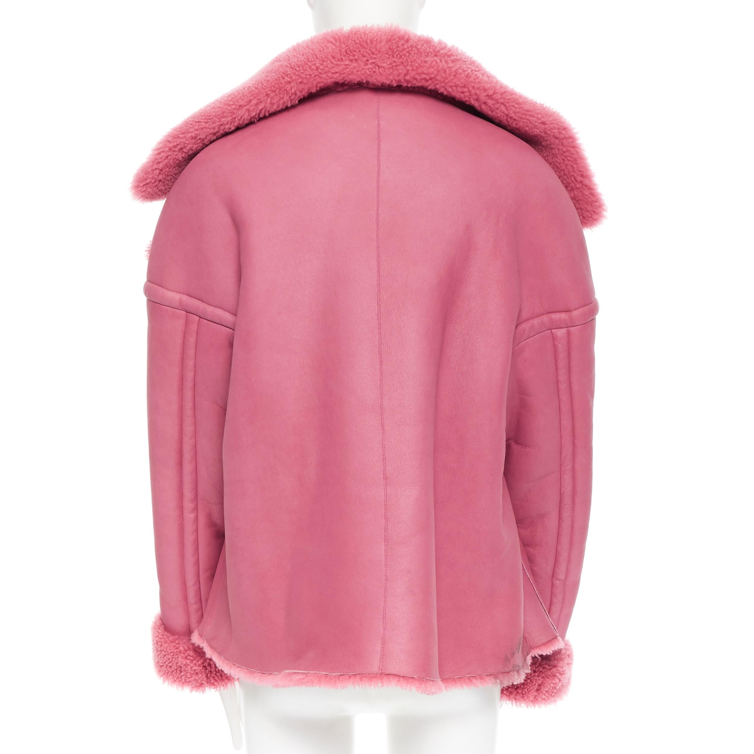 Pink OSCAR DE LA RENTA reversible pink shearling leather oversized aviator coat