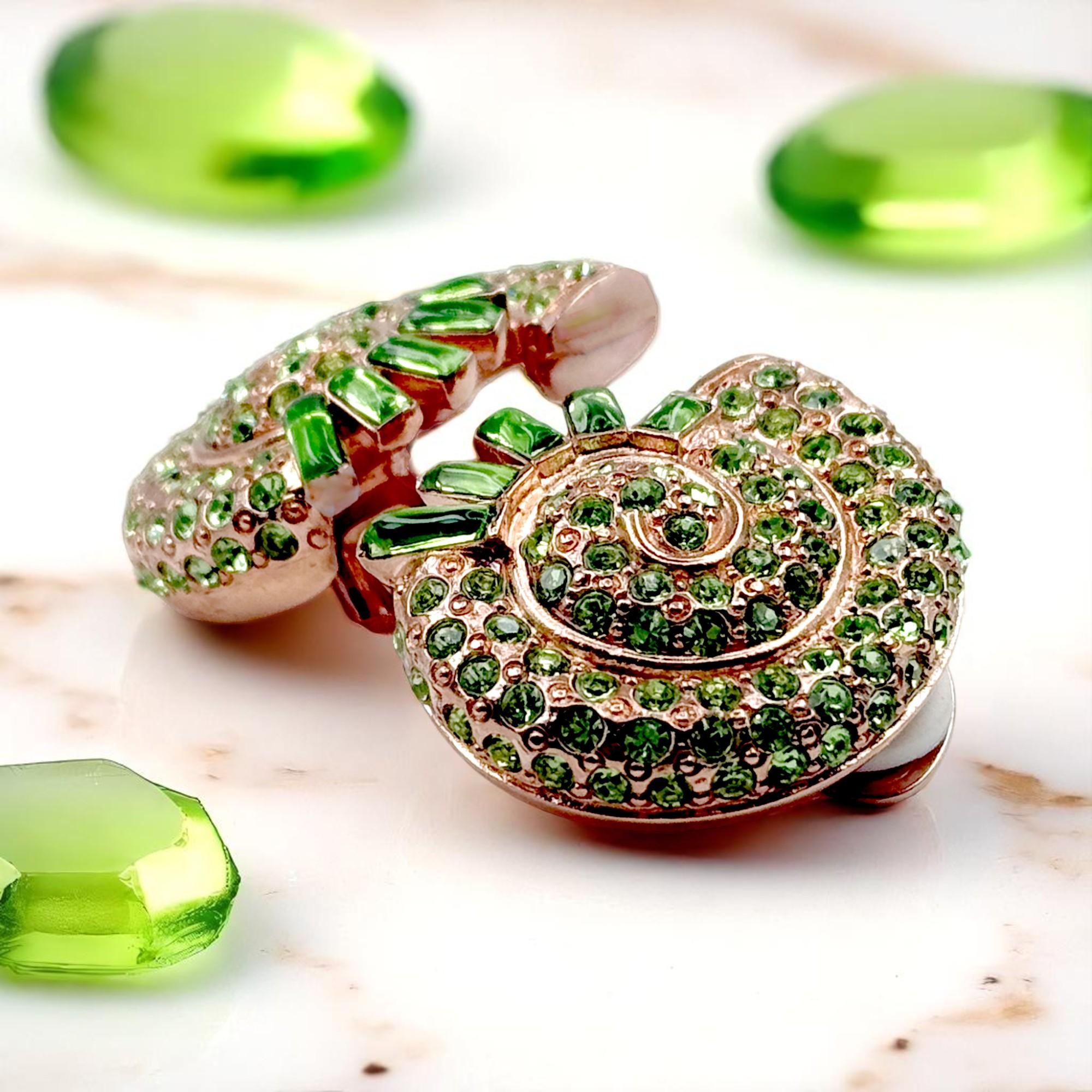 Contemporary Oscar de la Renta Rose Gold Nautilus Clip-On Earrings with Peridot Crystals For Sale