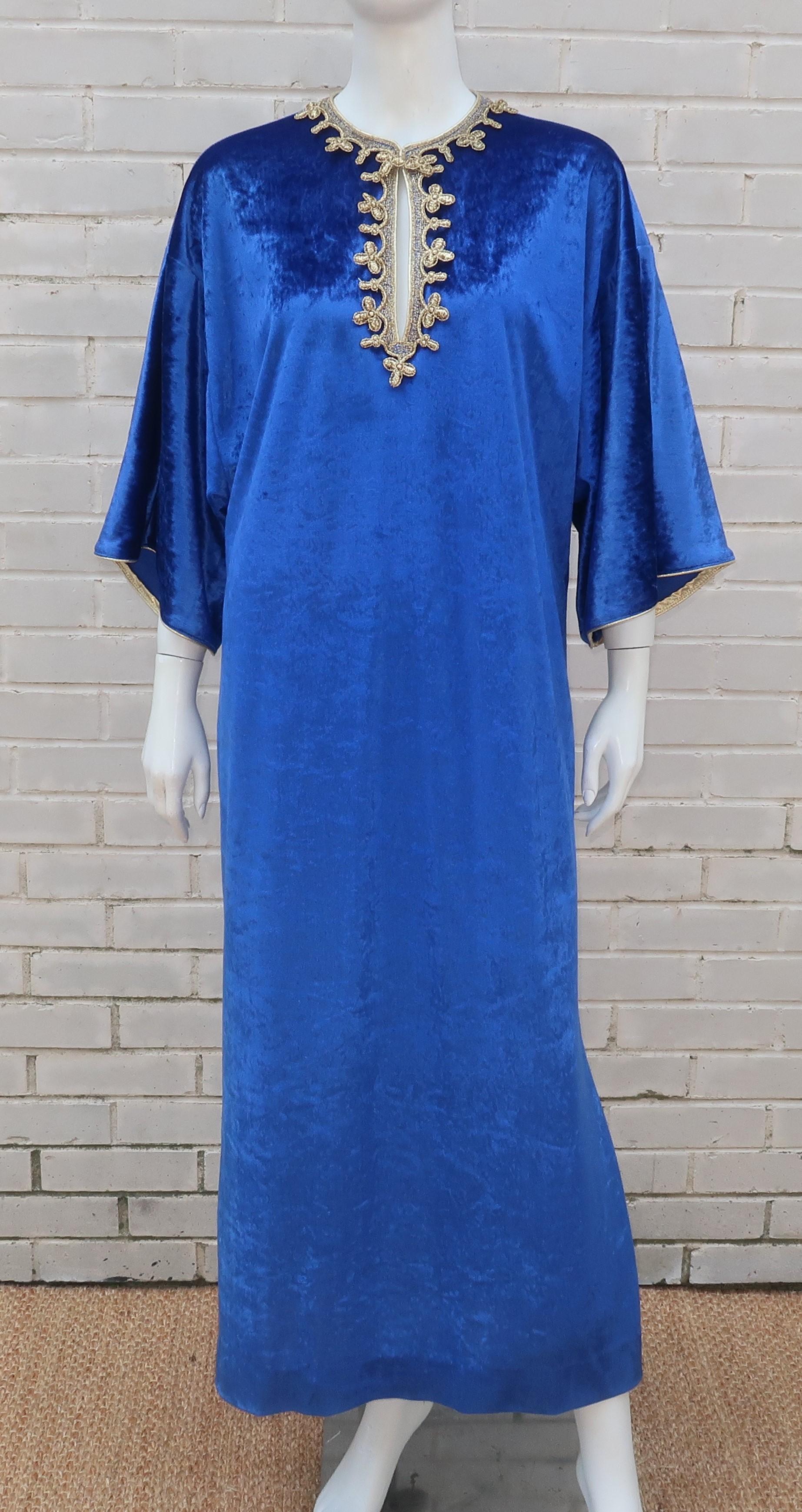 Lounge like a grand dame in a 1980's Oscar de La Renta crushed velvet caftan for Swirl.  The luxurious design has an exotic style and combines a beautiful royal blue shade with a metallic gold trim.  It offers an easy pull-on construction with bell