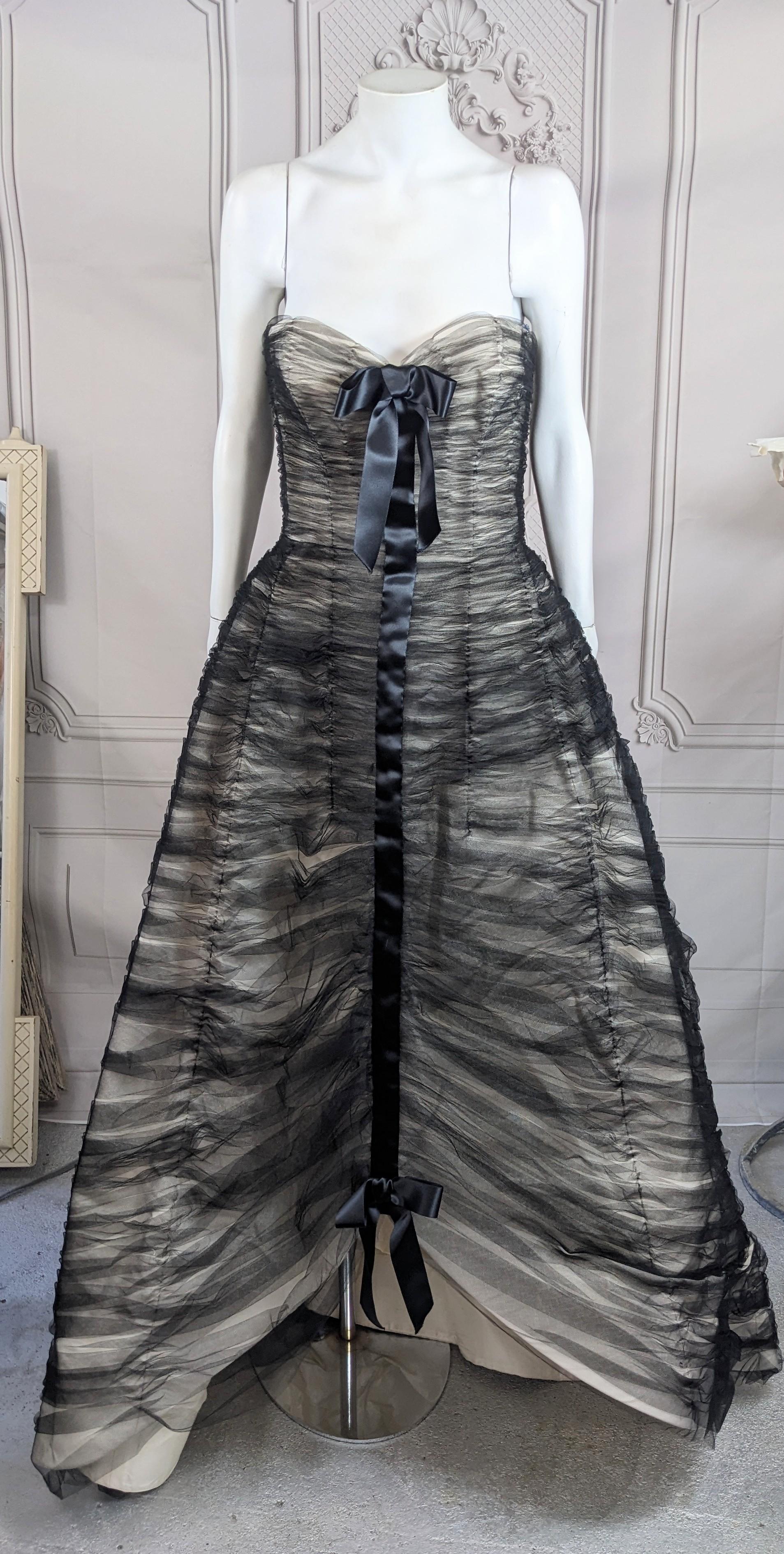 Oscar de la Renta Dramatic Ruched Tulle and Satin Gown from the 2000's. Cream silk satin is completely overlaid in ruched black tulle for a period French Haute Couture look. Oscar de la Renta's experience in the Mid Century Paris Couture scene