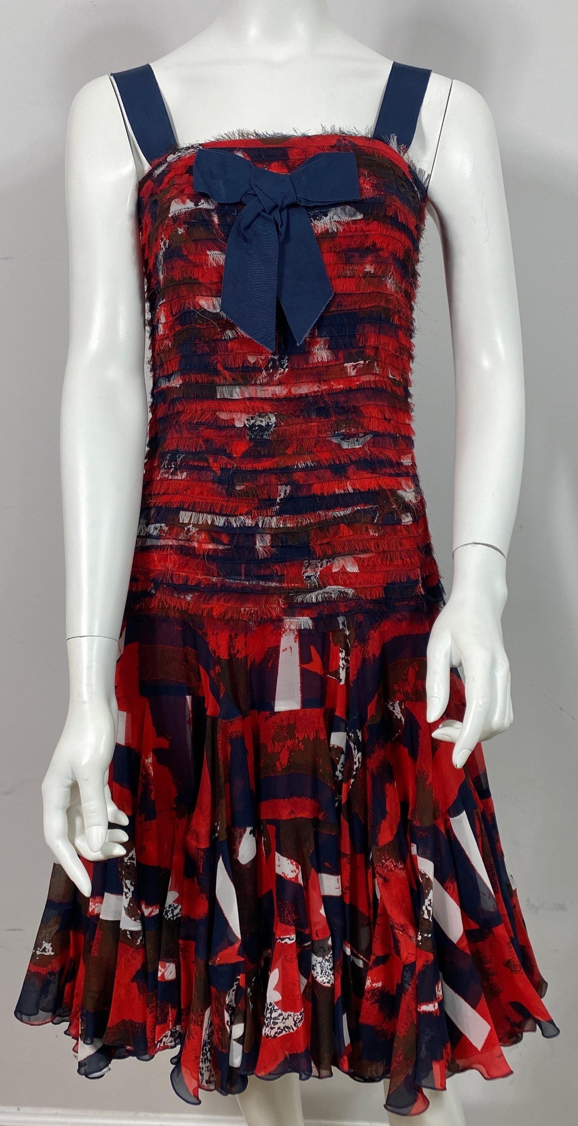 Oscar de la Renta Runway Pre Fall 2011 Red White and Blue Silk Dress- Size M  This runway Oscar creation was look #22 of the Pre Fall 2011 Collection. The dress is made of a red, blue and white silk print that has a fitted frayed edge shutter pleat