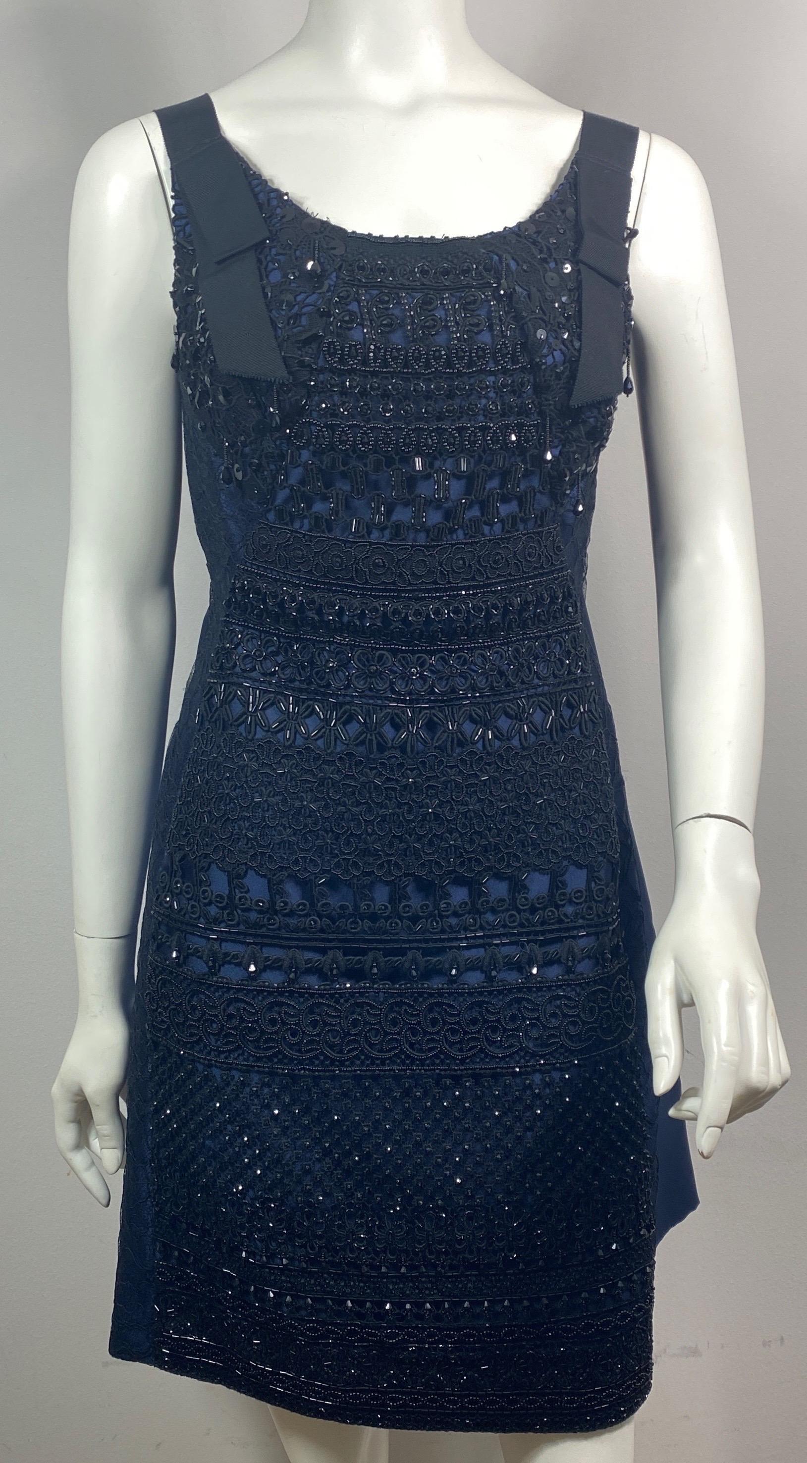 Oscar de La Renta Runway Resort 2016 Navy and Black Heavily Beaded Dress-Size 4 This stunning runway dress was look # in the Oscar De la Renta Resort 2016 Collection. The dress is a dark navy blue textured silk charmeuse with a top layer of a