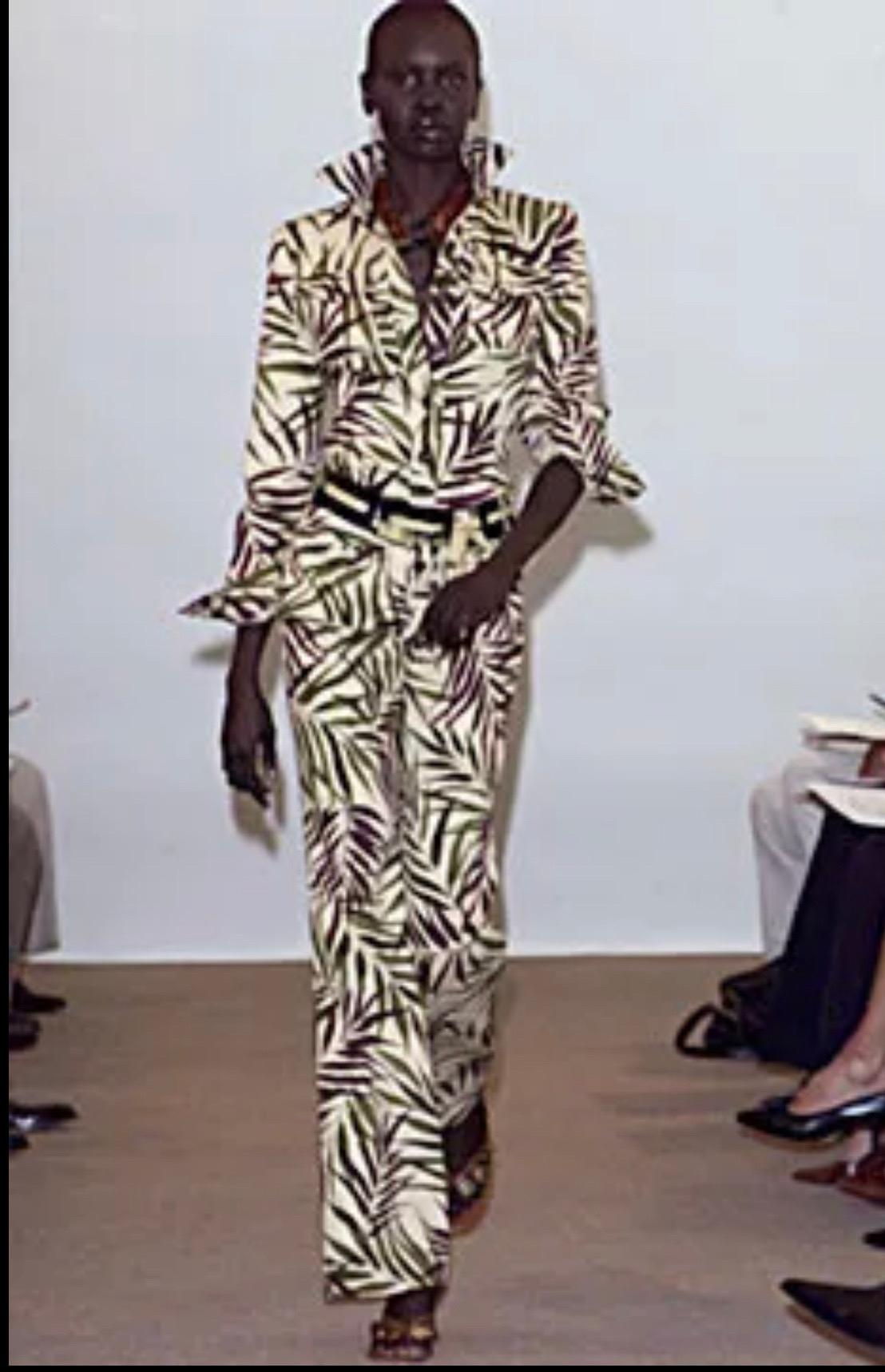 Chic Oscar de la Renta Spring / Summer 2002 runway vintage one piece jumpsuit ! Features a khaki background d with palm prints in green and brown. Sturdy cotton fabric is lined in silk chiffon. Wood buttons up the front and at each sleeve cuff.