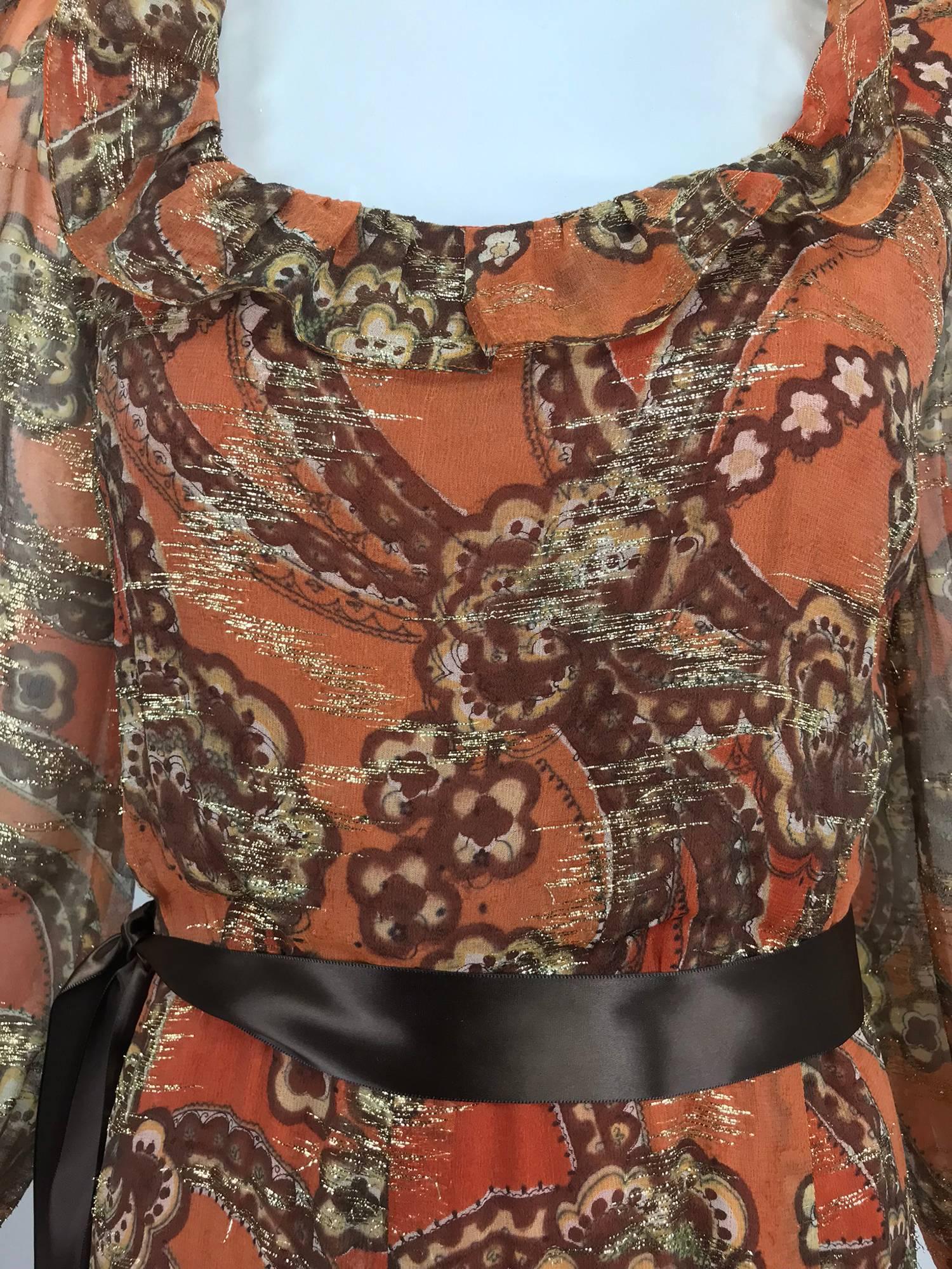 Oscar de la Renta russet print silk chiffon woven metallic brocade maxi dress from the 1970s. Swirling ribbons and flowers in brown and cream with a bold background of light and dark russet and throughout sparkling gold metallic thread, better to