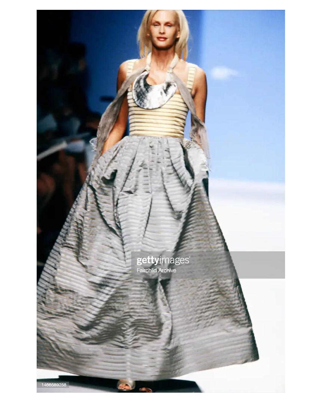 An incredible gown by Oscar de La Renta from the Spring Summer 2000 collection
Pale yellow corset style upper with a grey structured skirt that flares out beautifully 
Stripe pattern
Detachable belt that ties at the back into a large oversized