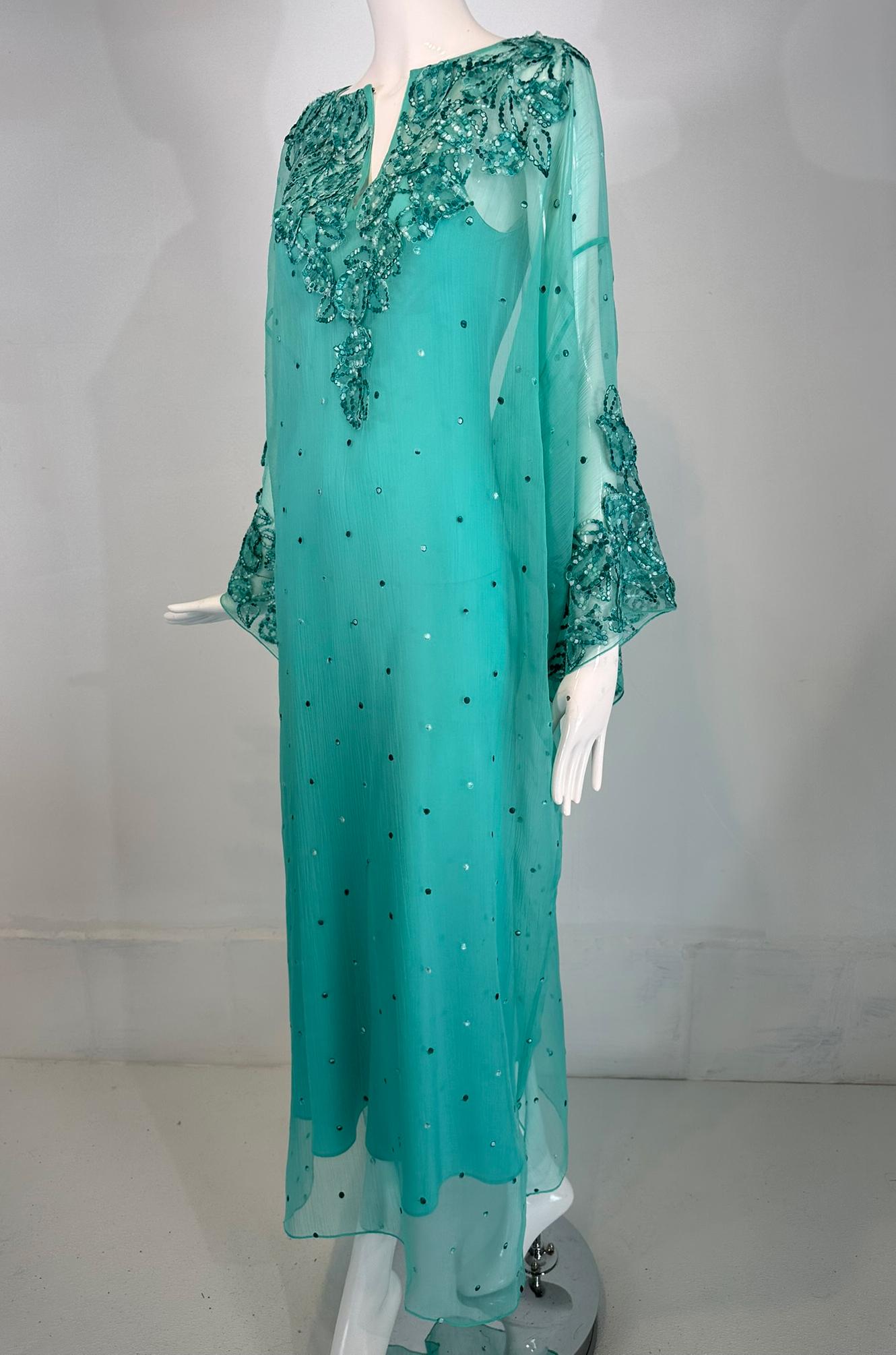Oscar de la Renta shimmery sheer aqua silk embroidered & appliqued caftan & matching silk slip. XS. Jewel neck with a center front slash, long full sleeves, the caftan is cut straight to the hem with side hem vents. Matching bias cut flair hem, silk