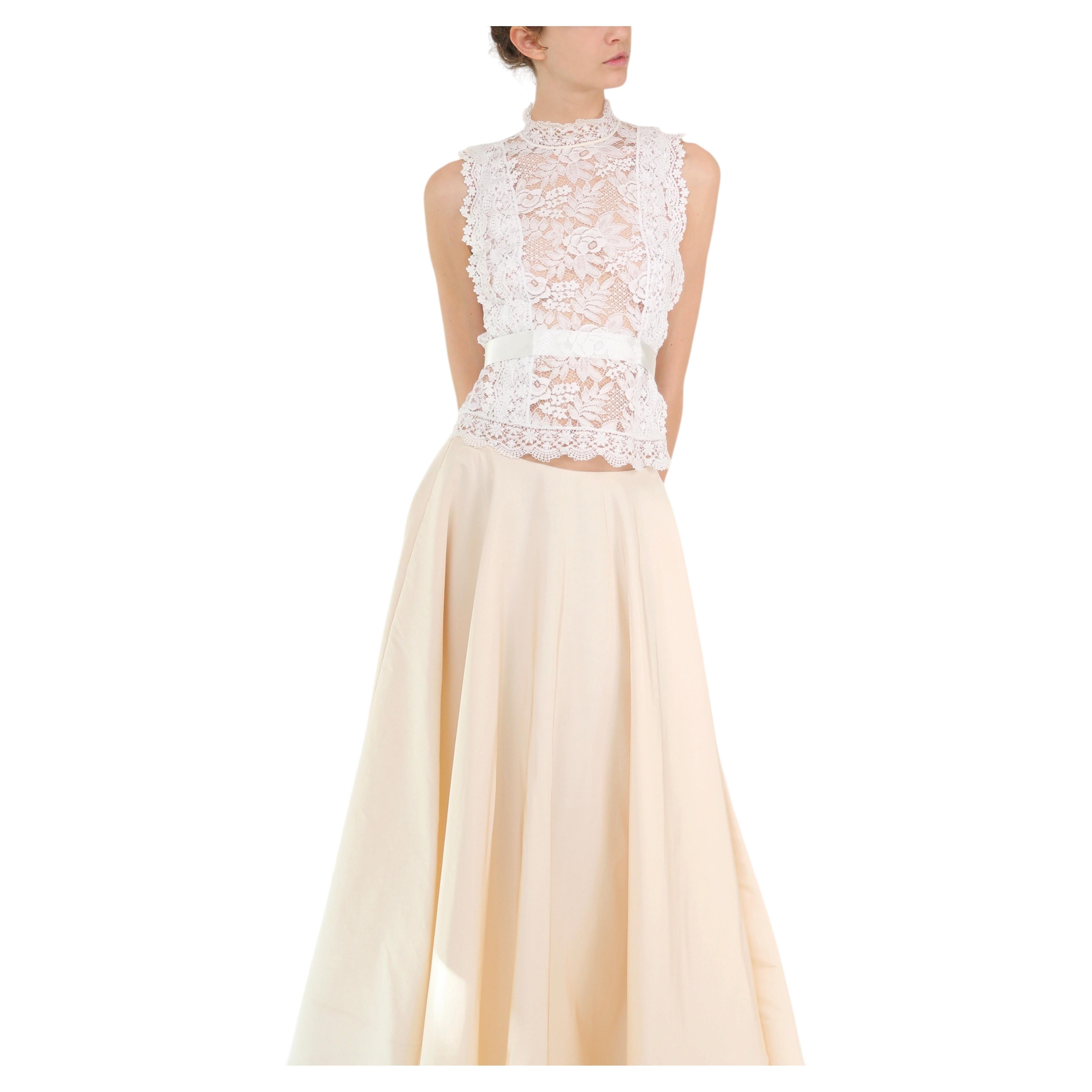 Camicetta da sposa senza maniche con collo alto in pizzo bianco di Oscar De La Renta, collezione Primavera/Estate 2016
