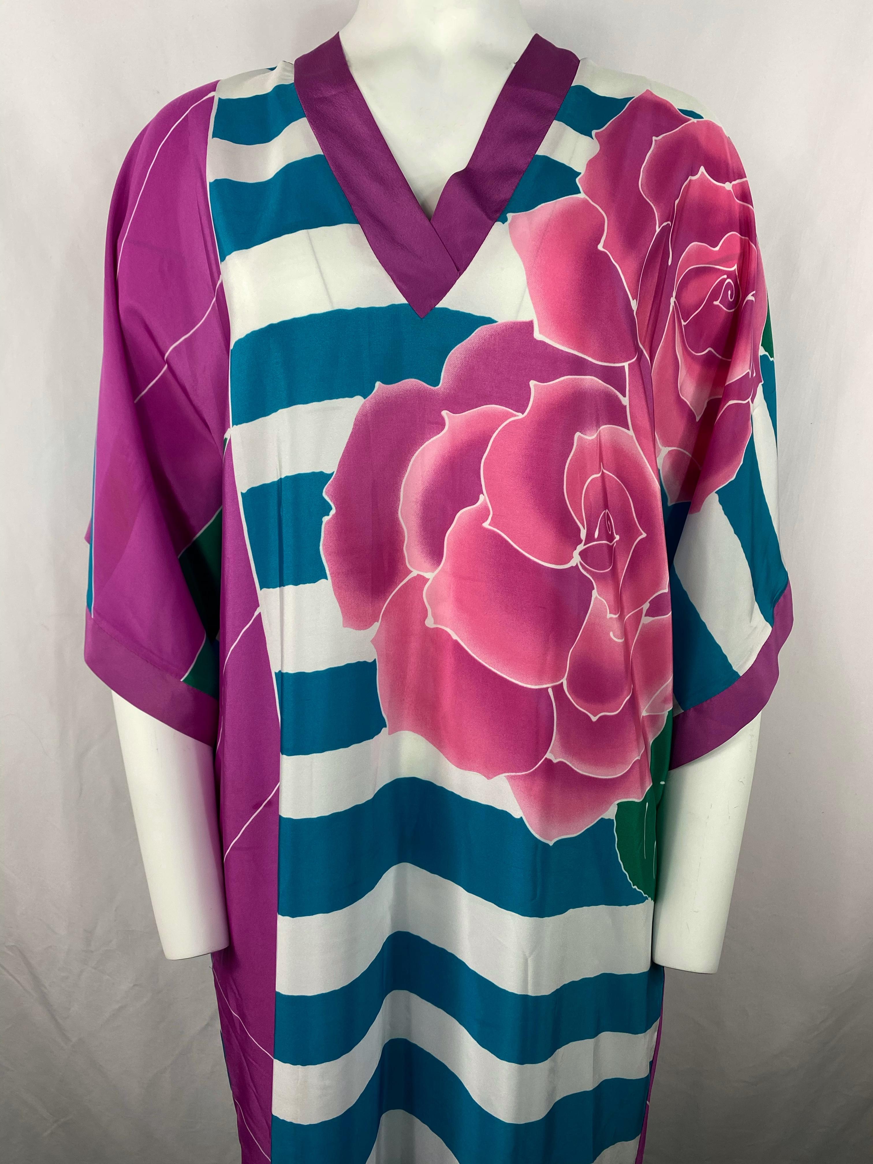 Product details:

Featuring purple, blue, white and green striped and floral print, floor length, pockets on each side, v neck, 3/4 wide sleeves, slit on one side (measures 16