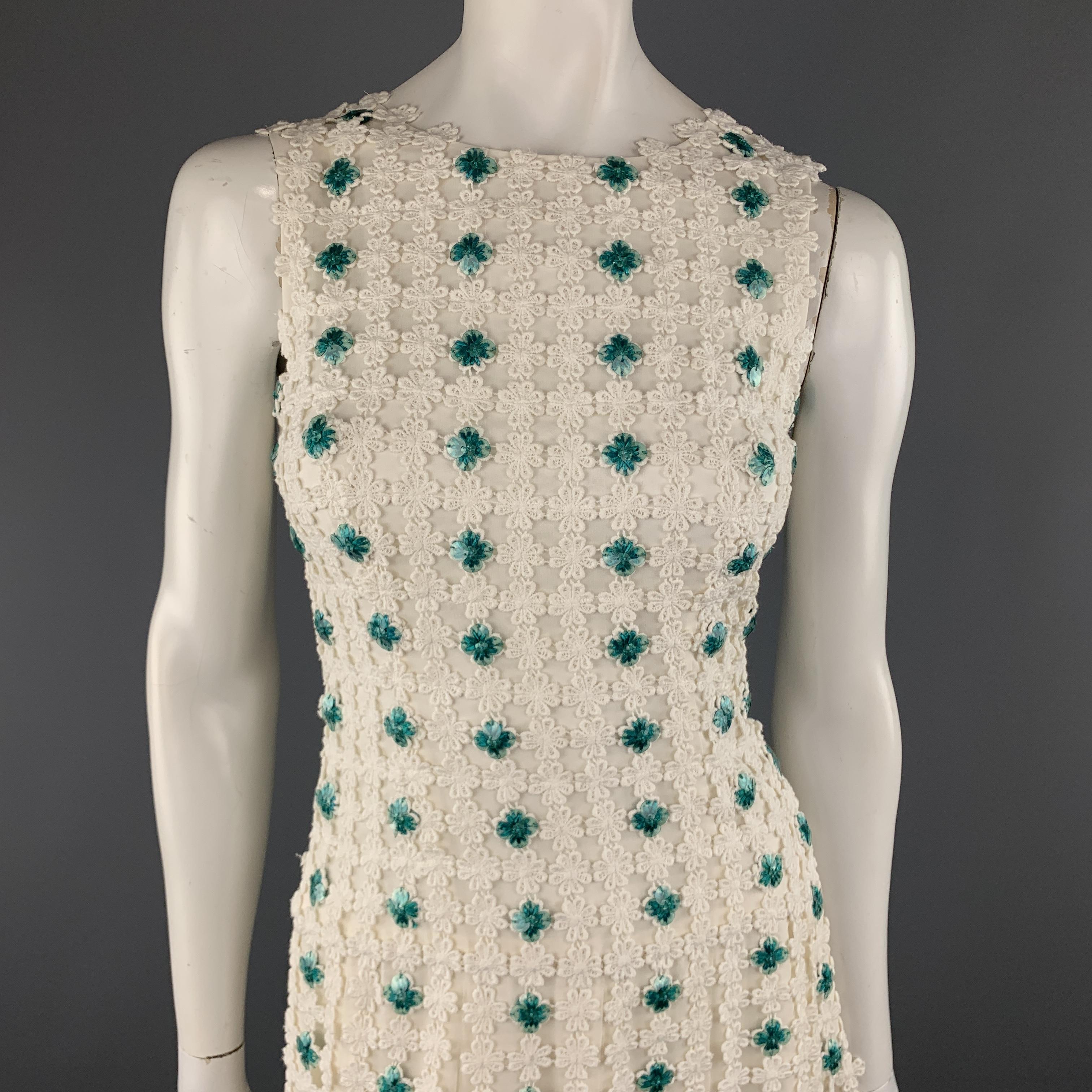 OSCAR DE LA RENTA Spring 2014 Collection sheath dress comes in cream silk chiffon with a lace overlay, pleated skirt, and turquoise green sequin flower details throughout. Made in USA.

Excellent Pre-Owned Condition.
Marked: