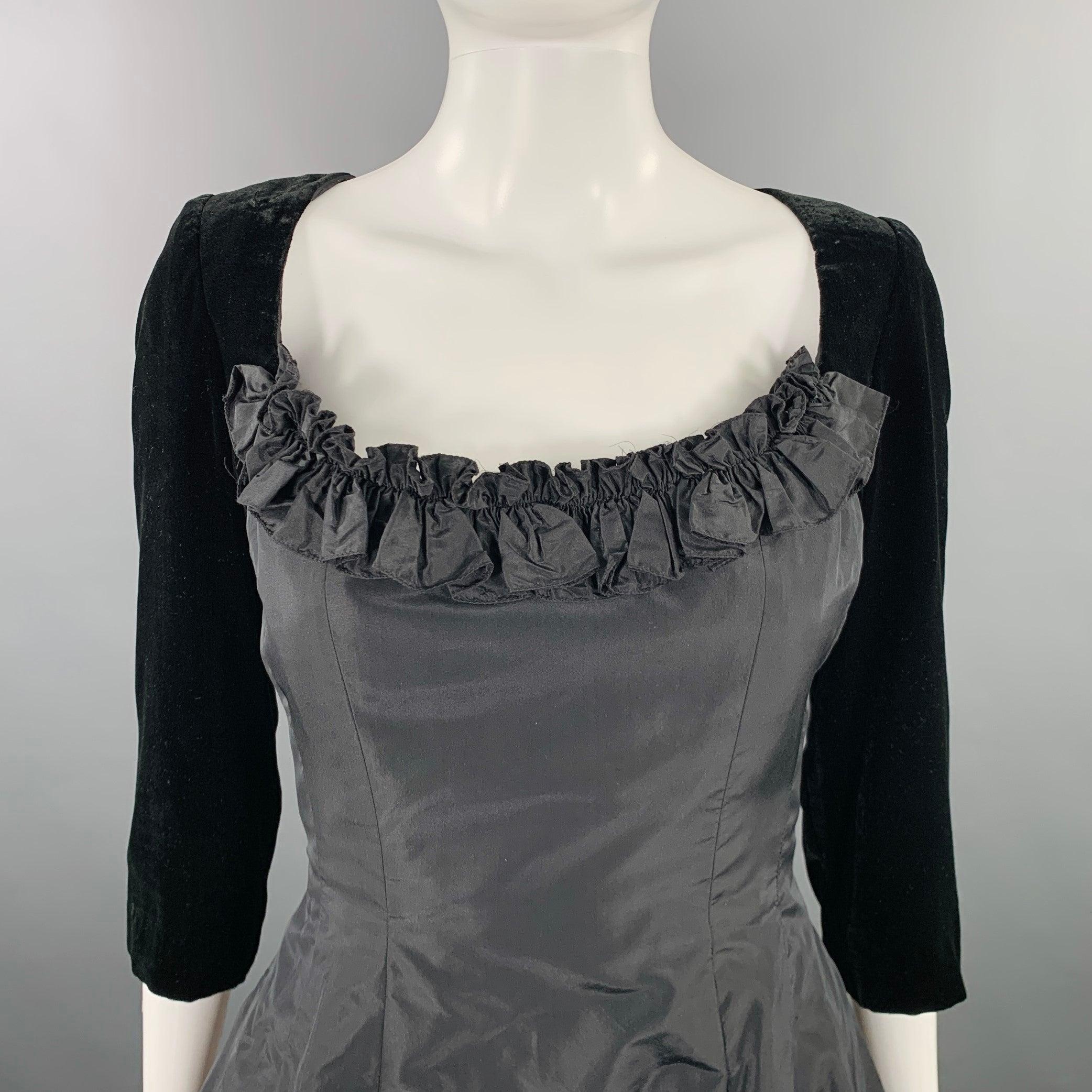 OSCAR DE LA RENTA Pink Label for NEIMAN MARCUS gown
in a black velvet and silk fabric featuring a two tone design, full skirt, ruffle neck details, and back zipper closure. Made in USA.Excellent Pre-Owned Condition. 

Marked:   10 

Measurements: 
