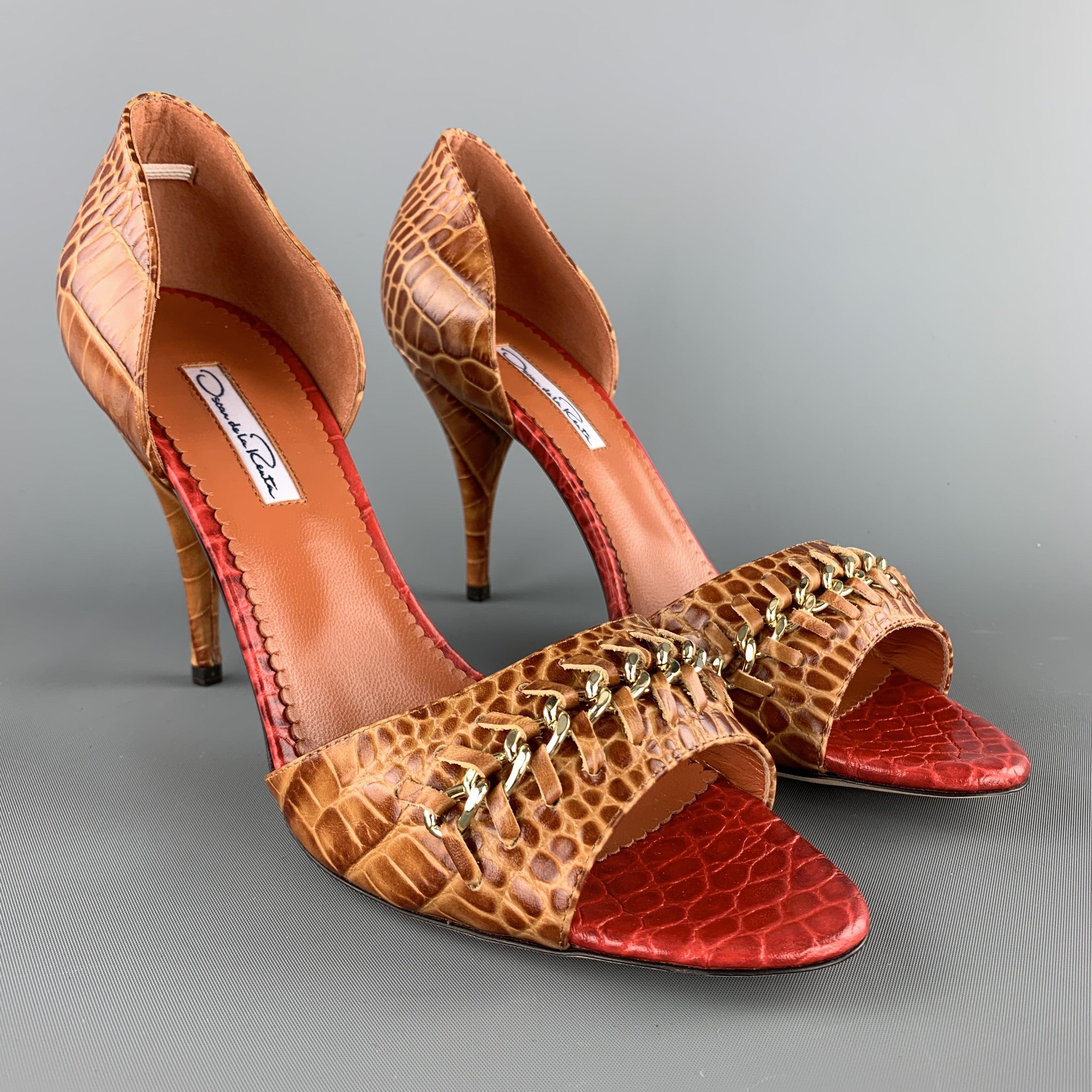 OSCAR DE LA RENTA D'orsay pumps come in tan alligator embossed leather with a peep toe, covered cone heel, red embossed leather insole, and gold tone chain woven toe strap accent. Made in Italy.New with Box.
 

Marked:   IT 40Heel:
4.25 inches 
  
 