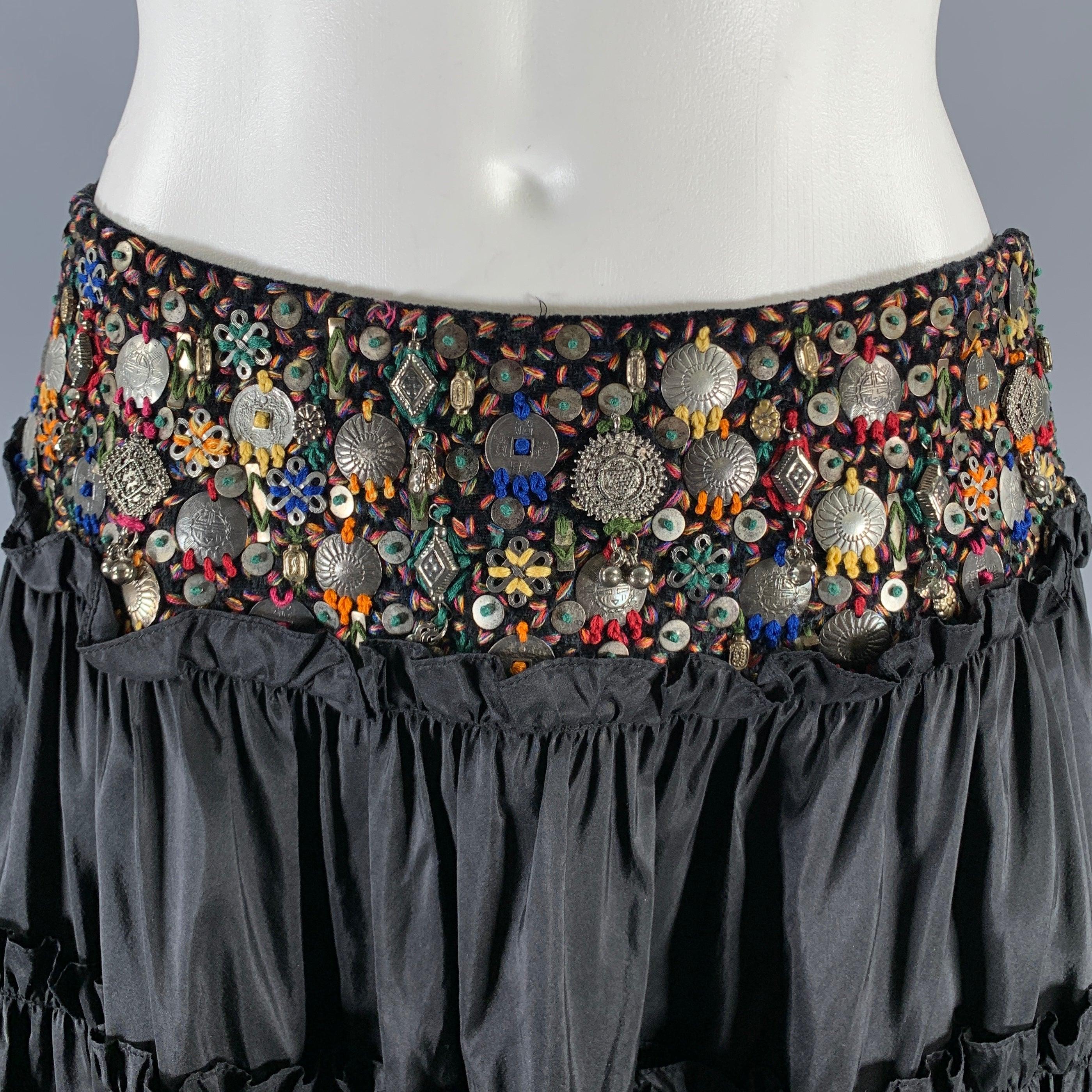 OSCAR DE LA RENTA skirt comes in a black ruffled knit material featuring low waisted, beaded detail at waist, and a side zip up
 closure. Made in USA.Excellent Pre-Owned Condition. 

Marked:   4 

Measurements: 
  Waist: 28 inches Hip: 50 inches
