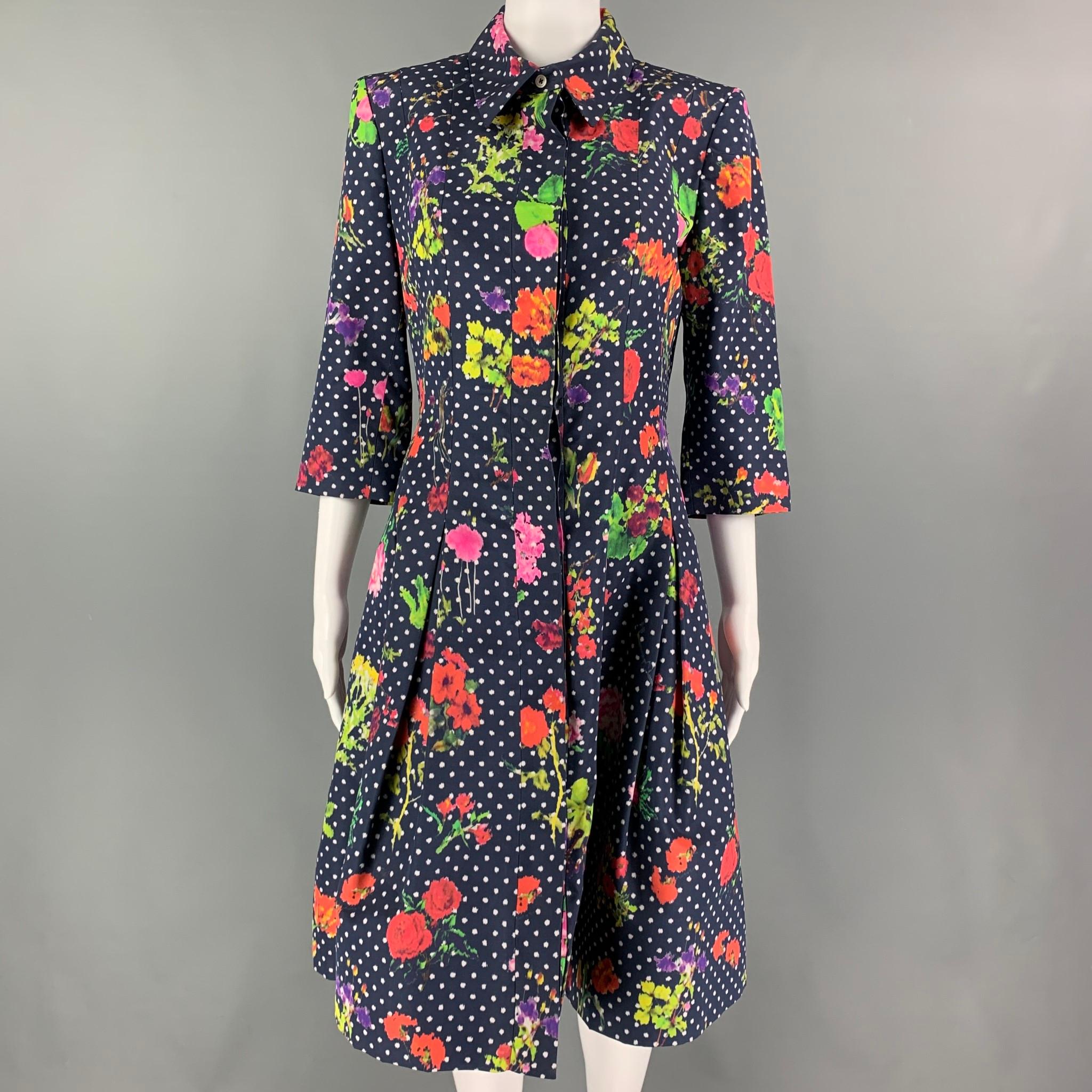 OSCAR DE LA DENTA coat comes in a multi-color floral silk featuring a full skirt design, pointed collar, and a hidden placket closure. 

Excellent Pre-Owned Condition.
Marked: 6

Measurements:

Shoulder: 15.5 in.
Bust: 34 in.
Sleeve: 17.5